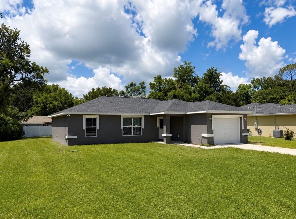 Welcome home to this beautifully maintained 3-bedroom, 2-bathroom residence built in 2024, located in the growing community of Summerfield. This modern home offers an open-concept floor plan with abundant natural light, a spacious living area, and a well-appointed kitchen featuring stainless steel appliances, ample cabinet space, and a functional layout perfect for everyday living.

The split-bedroom floor plan provides added privacy, while the primary suite features a private bathroom and generous closet space. Additional highlights include a dedicated laundry area in the garage with washer and dryer, energy-efficient construction, central air conditioning, and a spacious backyard ideal for relaxing or entertaining.

Conveniently located near Belleview, The Villages, Ocala, shopping centers, restaurants, medical facilities, schools, and major highways, this home offers the perfect balance of comfort and accessibility.