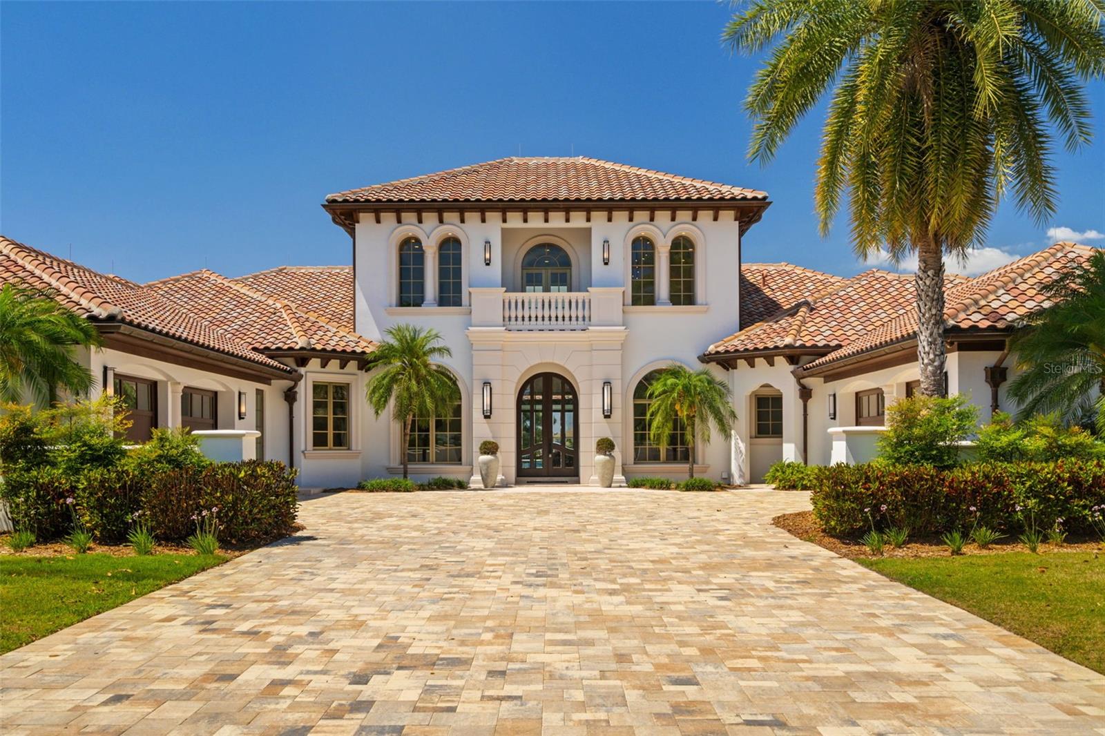 Fall in love with this extraordinary fully renovated lakefront estate by Davila Homes, an award-winning builder known for visionary design and unmatched craftsmanship. Located in the exclusive Isle of Lake Hancock—a private, gated enclave of just 34 homes—this is a rare opportunity to own a true masterpiece with lake views in both the front and back.

From the moment you enter the soaring double-height foyer, you’re greeted with sleek elegance and modern sophistication. A striking round glass staircase leads to a stylish loft, while the open-concept main floor flows effortlessly through light-filled living spaces that embrace Florida’s indoor-outdoor lifestyle.

The primary suite is a showstopper—massive in scale with a walk-in closet you’ll never want to leave and a spa-inspired bathroom that feels like a private retreat. The home also features a private gym, a versatile bonus room for entertaining, and designer finishes in every corner and a rare to find eight car garage.

Step outside to a resort-style lakeside lanai, complete with a screen-enclosed pool and panoramic water views. Whether you're sipping coffee at sunrise or hosting sunset gatherings, the setting is pure magic.

Set on the pristine Lake Hancock chain, this is a water lover’s dream—ideal for boating, wakeboarding, and skiing with access to two world-class slalom courses. Just minutes away, Hamlin Town Center offers future dock access to shops, dining, and entertainment. And with Disney, Winter Garden, and Windermere close by, you’re at the center of it all—yet worlds away.

Homes in this community almost never hit the market—and certainly not like this.
If you’ve been waiting for something extraordinary, this is it.
Schedule your private showing today.