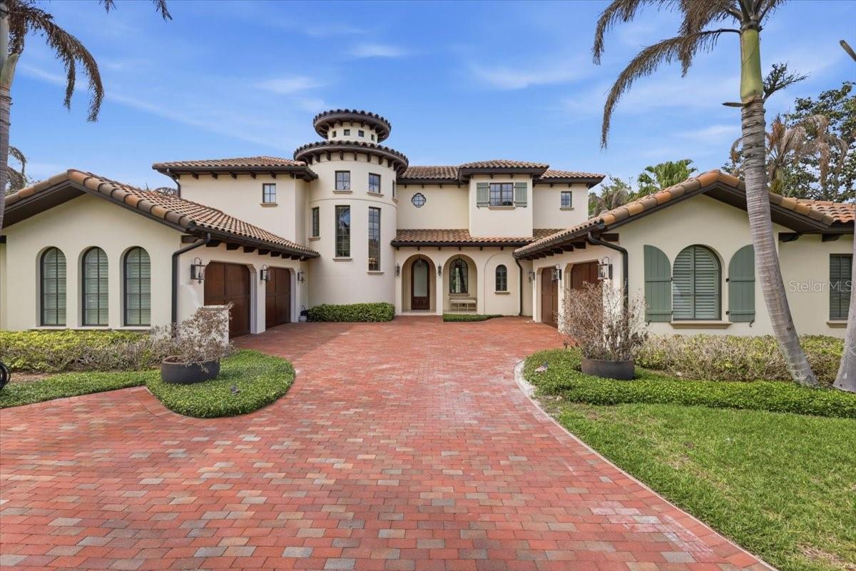 Welcome to an exceptional opportunity within the gates of Isleworth, one of Central Florida’s most Acclaimed private golf communities. Perfectly positioned along a tranquil pond and scenic walking trail, this move-in ready residence offers a rare blend of privacy, natural beauty, and refined living in the heart of Windermere.
Thoughtfully designed for both everyday comfort and elevated entertaining, the home features a versatile layout including a spacious primary suite, multiple guest bedrooms, an oversized office/playroom, and a dedicated theater room. Expansive living areas flow seamlessly, creating a warm yet Elegant atmosphere throughout—all easily accessible via a private elevator connecting the home’s levels.
The home delivers a true turnkey experience with modern finishes and enhancements, including a fully upgraded Crestron smart home system providing whole-home audio and video distribution for effortless control and convenience. A standout feature is the exceptional garage capacity, offering four individual single-car garages two of which are equipped with vehicle lifts.
The outdoor living experience is a true highlight, featuring a resort-style pool, generous covered entertaining spaces, and serene water views that create a peaceful and private backdrop. Whether enjoying quiet mornings by the water or hosting guests in the evening, the setting is both inviting and unforgettable.
Located within Isleworth—renowned for its championship golf course, world-class amenities, and guard-gated privacy—residents enjoy an unparalleled lifestyle surrounded by the Butler Chain of Lakes and beautifully manicured grounds.
This is a rare opportunity to own a fully updated, move-in ready home that seamlessly combines luxury, technology, and exceptional outdoor living in one of Orlando’s most sought-after communities.