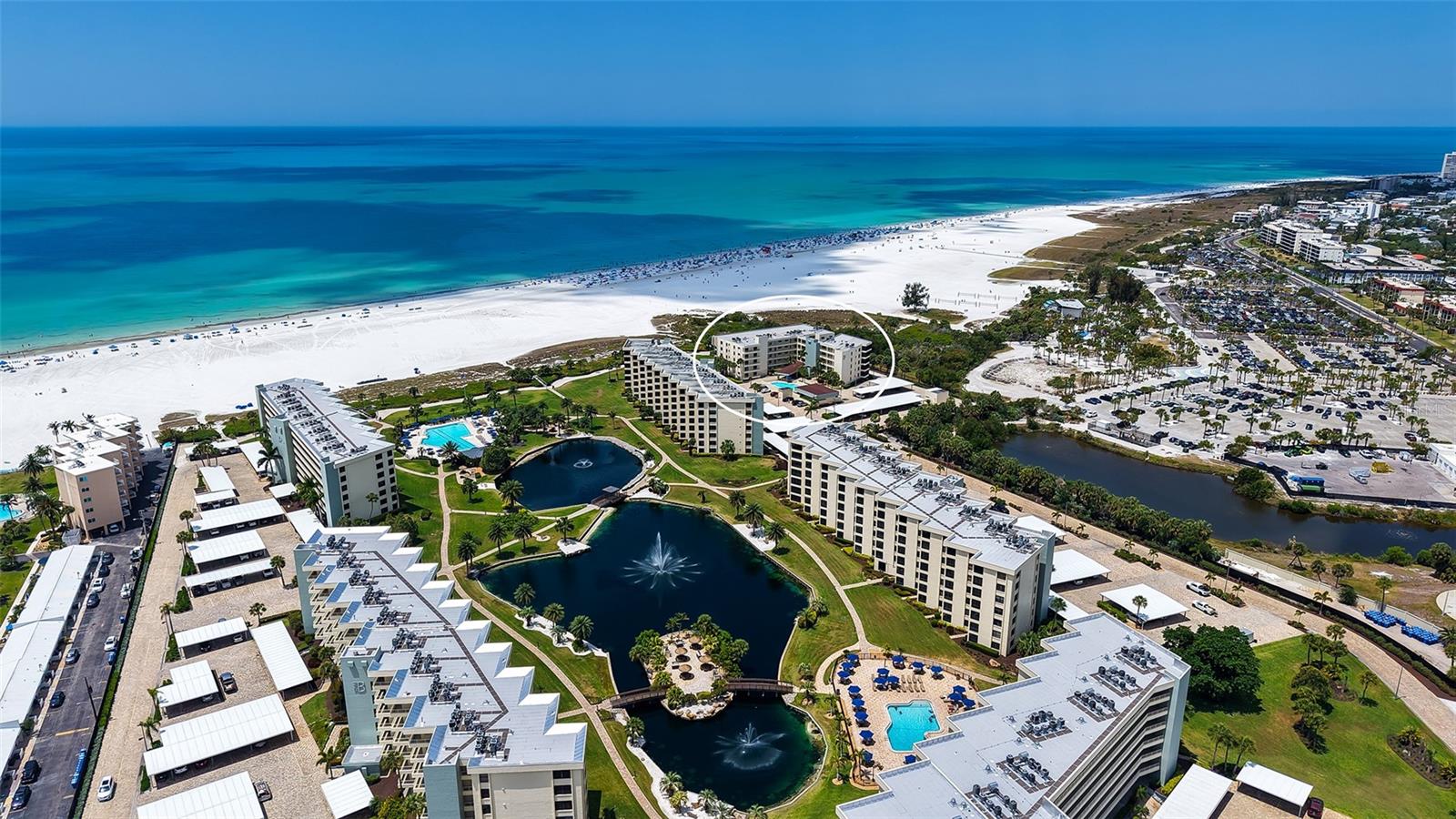 This Gulf-front, resort-style third-floor end unit offers breathtaking beach and Gulf views, abundant natural light, and an open-concept floor plan within an exclusive 24-hour guard-gated community. This inviting and luxuriously updated 2-bedroom, 2-bath condominium underwent a complete stud-to-finish renovation with all details thoughtfully taken care  providing a perfect coastal retreat.  

Elegant porcelain flooring flows throughout the residence, enhancing the bright, airy ambiance and reflecting the stunning natural light. The spacious designer kitchen is truly a showpiece, featuring custom wood cabinetry, gorgeous granite countertops, and top-of-the-line appliances. Both bathrooms provide a spa-like experience with stylish finishes and fixtures, including a relaxing jetted tub in one bathroom.

Designed for effortless resort living, the oversized laundry room offers additional storage and a deep utility sink for convenience. Every window and sliding glass door has been upgraded to impact-rated standards, while the entire interior has been meticulously renovated with timeless coastal elegance.

Enjoy spectacular beach views from the comfort of your living room while watching beach volleyball below. Perfectly positioned close to the activity, yet offering exceptional privacy, the expansive impact-rated sliders invite in refreshing Gulf breezes along with panoramic views of the turquoise water, white sand beach, and endless blue sky.

Few properties can offer both direct Siesta Key Beach access and true Gulf-front views just steps from your door. Gulf & Bay Club is situated on 32 beautifully landscaped tropical acres along world-famous Siesta Beach and offers an unmatched resort lifestyle with 800 feet of private beach frontage.

Residents enjoy an impressive array of amenities, including:

Three swimming pools, including one overlooking the beach
State-of-the-art fitness center with cardio, strength training, and yoga facilities
Eight tennis courts, including a Har-Tru court
Pickleball, basketball, racquetball, and shuffleboard courts
Six dry saunas and a hot tub
Two freshwater lakes
Six BBQ areas and a private picnic island
Complimentary Wi-Fi at the clubhouse
On-site management
Electric vehicle charging stations and car wash area

This unit also includes a designated covered parking space, expansive grounds to explore, and endless opportunities to stroll the world-renowned white sand shoreline before falling asleep to the soothing sound of rolling waves. Owners also have access to a private guest suite that can be reserved for visiting family and friends.

Located just minutes from the charming shops and restaurants of Siesta Village, this exceptional property is ideal as a full-time residence, luxurious vacation getaway, or outstanding investment opportunity.

Experience unforgettable sunsets and embrace the ultimate beachfront lifestyle. This rare slice of paradise on Siesta Beach truly has it all.