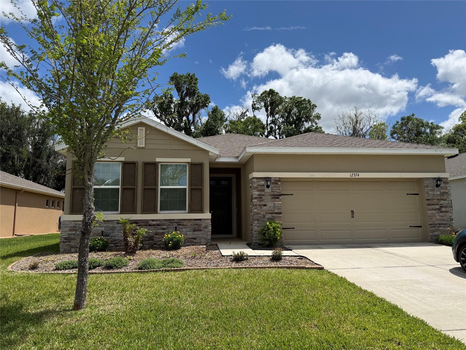 BUYER/BUYERS AGENT IS RESPONSIBLE FOR VERIFYING HOA FEES & DUES, COMMUNITY RULES, IF ANY, BLDG .SQ FT, HVAC, WATER & POWER SOURCE, LOT SIZE, ROOM/BLDG MEASUREMENTS, FLOOD ZONE, EGRESS/INGRESS, TAXES AND ZONING TO INCLUDE MLS DATA FOR ANY ERRORS AND OMISSION.  
Welcome to an exceptional opportunity to own a newer home in the prestigious, guard-gated community of Lake Jovita Golf & Country Club. Built in 2020 and impeccably maintained, this pristine 3-bedroom, 2-bathroom, 2-car garage residence offers 2,057 square feet of elegant yet comfortable living space designed for today’s Florida lifestyle.

From the moment you enter, you will appreciate the spacious open floor plan, abundant natural light, and seamless flow between the living, dining, and kitchen areas—perfect for entertaining family and friends. The well-appointed home features a dedicated laundry room, generous storage, and a private primary suite with an impressive oversized walk-in closet.

Relax and enjoy the tranquility of your screened-in patio overlooking a private backyard, creating the perfect setting for morning coffee, outdoor dining, or peaceful evenings surrounded by nature. The home offers the benefits of newer construction with the ease of low-maintenance living.

Located within the sought-after Lake Jovita community, residents enjoy a private guarded gate entrance, beautiful surroundings, and a very reasonable HOA that includes lawn maintenance and internet service. Membership to the Lake Jovita Golf & Country Club is optional, allowing residents the opportunity to enjoy championship golf, clubhouse dining, social activities, and additional resort-style amenities if desired.

This is a rare opportunity to enjoy the security, elegance, and relaxed Florida lifestyle of Lake Jovita in a move-in-ready home where every detail has been thoughtfully cared for.