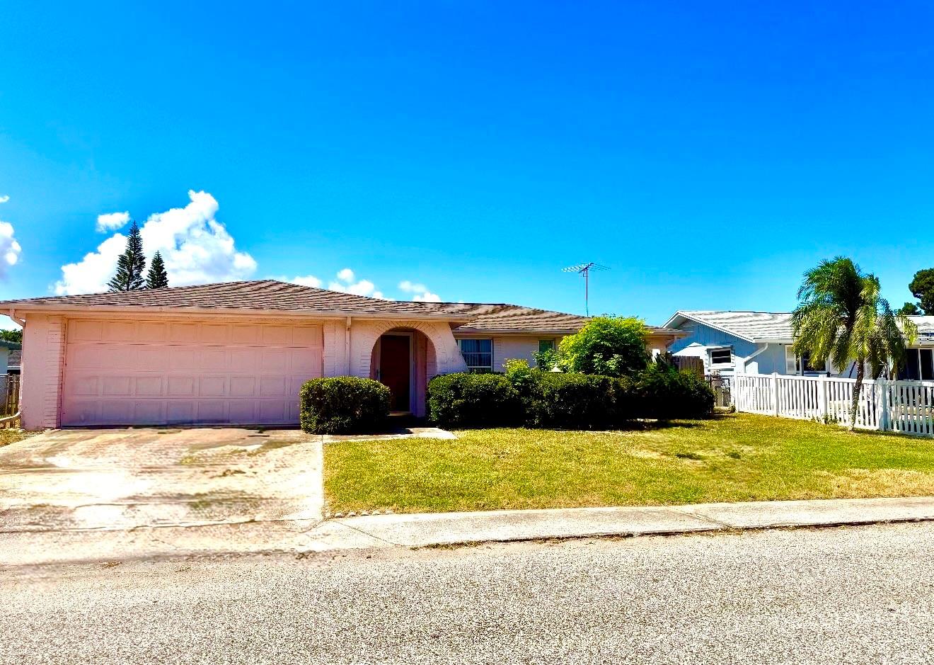 MOVE-IN READY WITH BIG-TICKET UPGRADES ALREADY DONE!

Welcome home to this charming 2-bedroom, 2-bath, 2-car garage home ideally located in the heart of Pasco County! Enjoy peace of mind knowing the major updates have already been completed, including a Brand-New Roof, Brand-New A/C System, and Brand-New Electrical Panel—saving you thousands in future expenses.

Step inside to discover a bright and inviting floor plan featuring new ceramic tile flooring in the kitchen and bathrooms. The spacious great room flows seamlessly into the dining area, creating the perfect space for everyday living and entertaining.

The oversized kitchen offers abundant cabinet and counter space and opens directly into the versatile Florida Room—an ideal spot for morning coffee, hobbies, or relaxing with family and friends. The Florida Room conveniently connects back to the dining area, creating an easy-flowing layout you'll love.

Both bedrooms are generously sized, while the two full bathrooms provide comfort and convenience, featuring one bath with a tub/shower combination and the other with a walk-in shower.

Outside, you'll find a large fenced backyard with endless possibilities—create your dream garden, add a play area, or host unforgettable gatherings with plenty of room to spare.

Conveniently located near shopping, dining, medical facilities, and some of Florida's most beautiful Gulf Coast beaches, this home offers the perfect blend of comfort, value, and location.
 Major Updates. Spacious Living. Fantastic Location. Don't miss your opportunity to make this Pasco County gem your own!