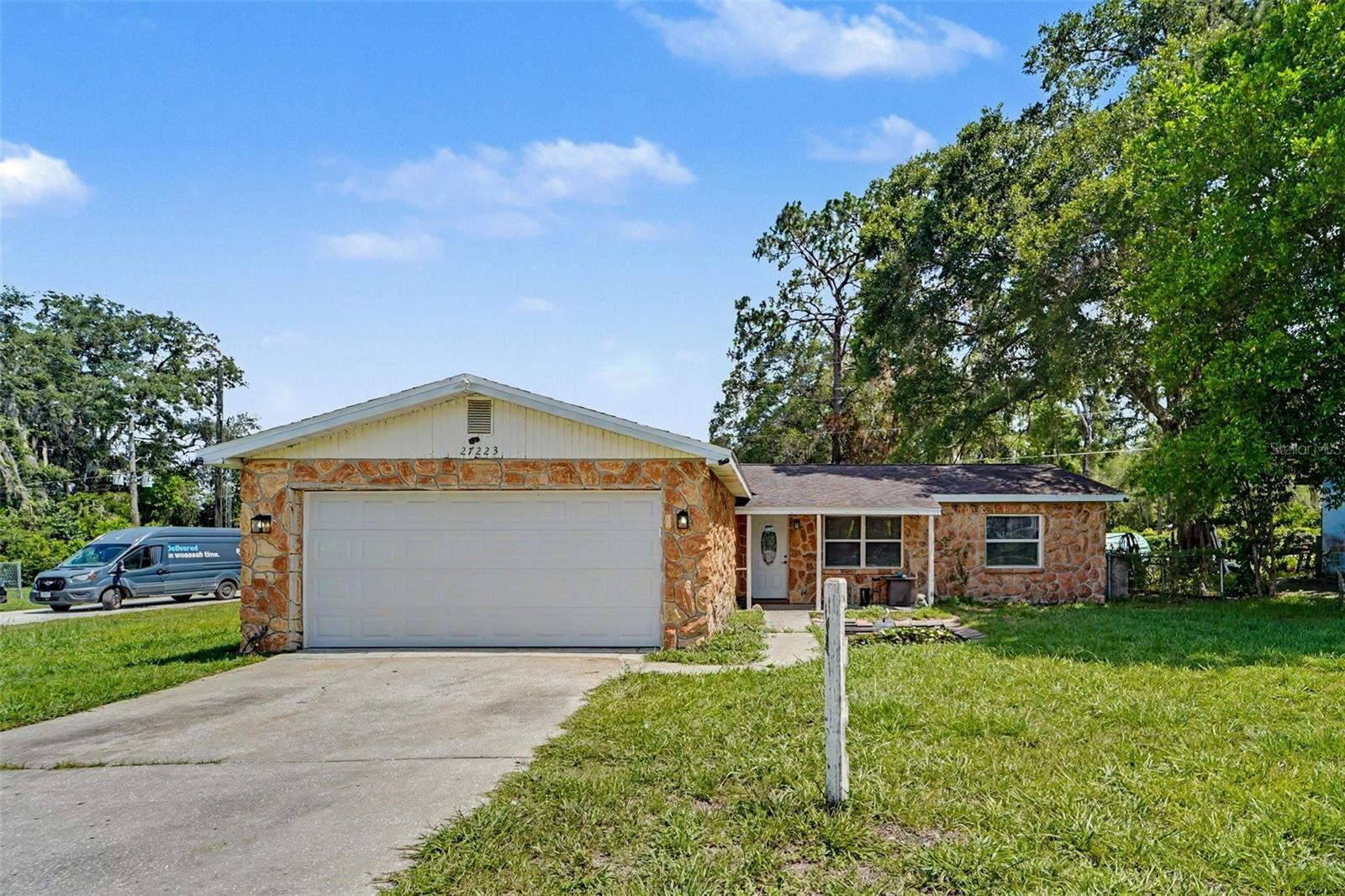 Welcome to 27223 Roper Road, where comfort, convenience, and modern updates come together! This charming 3-bedroom, 2-bath home has been thoughtfully updated and is truly move-in ready. The fully renovated kitchen, completed within the last year, serves as the heart of the home and features stylish cabinetry, beautiful countertops, modern fixtures, and updated finishes that make cooking and entertaining a pleasure.

The inviting floor plan offers durable tile and wood-look laminate flooring throughout, updated bathrooms, ceiling fans in every room, an indoor laundry area, and a versatile Florida room that provides additional living space perfect for a home office, playroom, fitness area, or relaxing retreat.

Step outside to enjoy the fully fenced backyard with plenty of room for pets, gardening, entertaining, or weekend barbecues. A detached workshop/storage shed offers exceptional space for tools, hobbies, or extra storage, while the spacious two-car garage provides ample room for vehicles and equipment. Situated on a desirable corner lot with added privacy, this home is conveniently located near schools, shopping, dining, and major highways, making everyday commuting a breeze.

Whether you're a first-time homebuyer, looking to downsize, or searching for a fantastic investment opportunity, this beautifully updated property offers incredible value and is ready for its next owner. Don't miss your opportunity to call this one home!

Enjoy Everything Brooksville Has to Offer
Living at 27223 Roper Road means you're just minutes from some of Hernando County's best attractions:

Explore miles of hiking, biking, horseback riding, and wildlife viewing at the Withlacoochee State Forest.
Stroll through historic downtown Brooksville, filled with local boutiques, coffee shops, antique stores, and seasonal festivals.
Spend the afternoon at Boyett's Grove & Citrus Attraction, a true Old Florida destination featuring citrus treats, family activities, and local charm.
Enjoy kayaking, fishing, and nature trails at nearby parks and preserves while still being within easy reach of Tampa for work or entertainment.
Local Favorites
Breakfast: Florida Cracker Kitchen – Famous for hearty Southern breakfasts and homemade biscuits.

Lunch: Taco De Oro – A local favorite serving fresh, authentic Mexican cuisine.

Dinner: Prime 88 Steakhouse – Perfect for date nights or celebrations with premium steaks, seafood, and an excellent wine selection.

This home combines recent renovations, functional living space, and a fantastic Brooksville location, making it an exceptional opportunity for buyers looking for a home they can move into and immediately enjoy.
