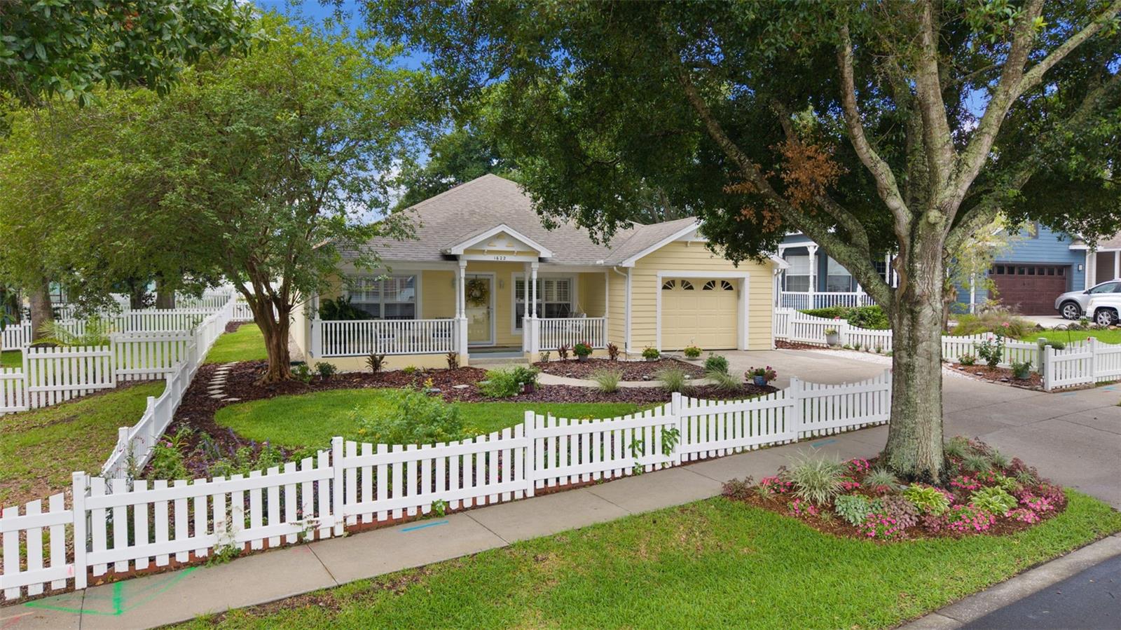 Tucked back in a quaint, semi-secluded neighborhood on Little Lake Elsie known for it's picket fences and front porches ... This home offers the perfect blend of comfort, character and convenience. NO HOA and located in a golf cart-friendly community just minutes from downtown Tavares. The welcoming front porch is the perfect place to relax and enjoy the peaceful surroundings, and YES the porch swing conveys! Inside, you'll find a well-maintained 3-bedroom, 2-bath home featuring durable vinyl flooring throughout the main living areas, carpeted bedrooms, and beautiful plantation shutters in the living room and primary bedroom. All window treatments will remain, making this home move-in ready. The dining area, conveniently located just off the kitchen, opens to a screened back porch overlooking a spacious, a beautiful landscaped, fenced backyard. Whether you're entertaining guests, giving pets room to roam, or simply enjoying Florida's beautiful weather, this outdoor space is sure to impress. An inside laundry area offers convenience with additional hook up available in the garage. All shelving in the garage will remain with the home.  The gas/propane generator, chest freezer, and select furnishings are negotiable. There is a termite bond in place offering peace of mind. This home has been meticulously cared for, with major improvements including a new water heater (2021), complete plumbing re-pipe (2021), roof replacement (2019), A/C system (2018), refrigerator (2024), front storm door (2022), and dishwasher, stove, and microwave (2020). Additional upgrades include epoxy-finish garage floor in 2023 complete circuit breaker upgrade 2026. Ideally located between downtown Tavares and historic Mount Dora, you'll enjoy easy access to local festivals, waterfront activities, parks, restaurants, boutiques, and year-round community events. This charming cottage is a wonderful opportunity to enjoy the best of  Florida living.  Don’t miss this opportunity to own this home … schedule your appointment today!
