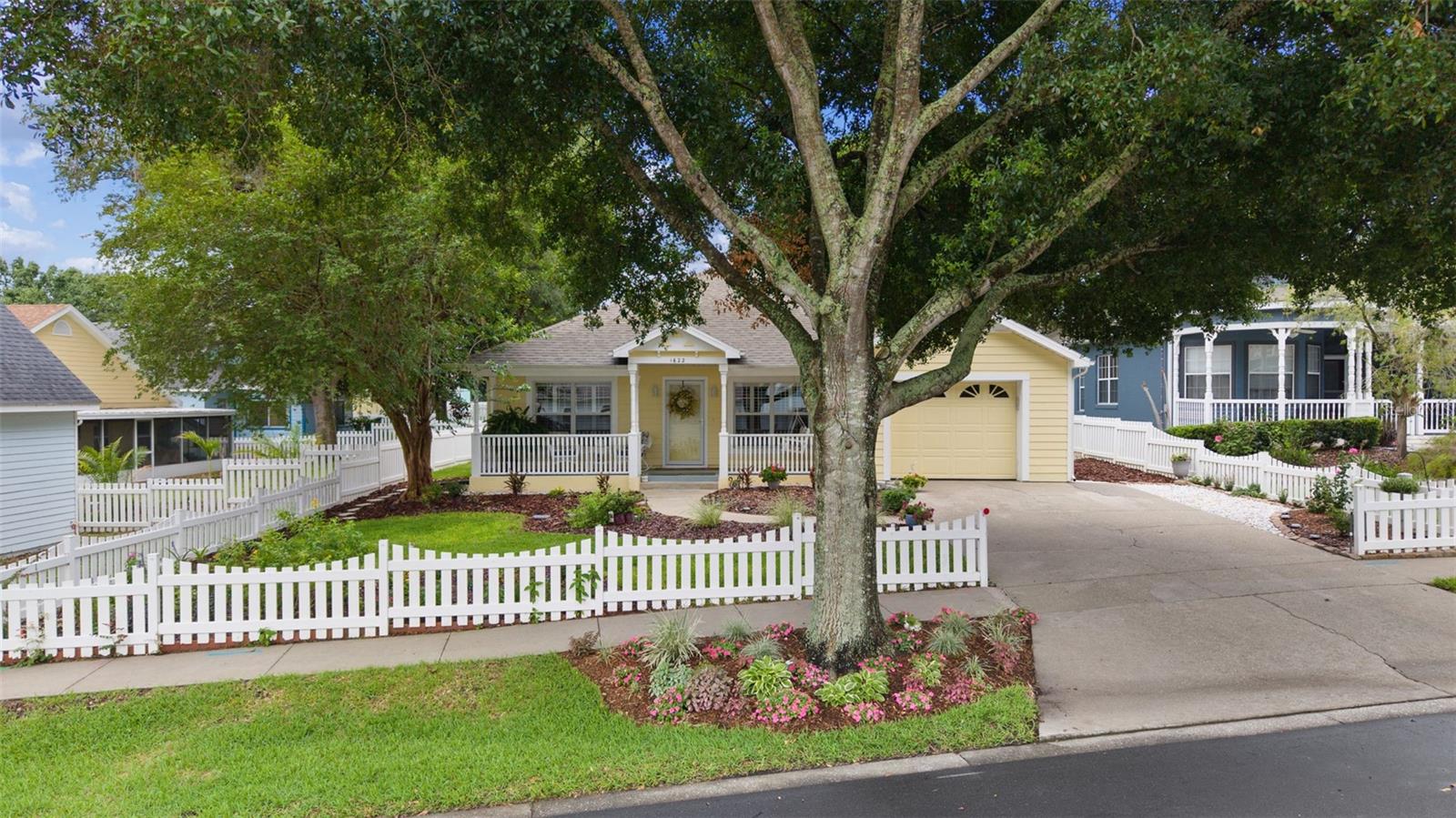 Nestled in a quaint, semi-secluded neighborhood on Little Lake Elsie this home offers the perfect blend of comfort, character and convenience, all with no HOA and located in a golf cart-friendly community just minutes from downtown Tavares.  The welcoming front porch is the perfect place to relax and enjoy the peaceful surroundings, and YES the porch swing conveys with the property. Inside, you'll find a well-maintained 3-bedroom, 2-bath home featuring durable vinyl flooring throughout the main living areas, cozy carpeted bedrooms, and beautiful plantation shutters in the living room and primary bedroom. All window treatments will remain, making this home move-in ready. The dining area, conveniently located just off the kitchen, opens to a screened back porch overlooking a spacious, a beautiful landscaped, fenced backyard. Whether you're entertaining guests, giving pets room to roam, or simply enjoying Florida's beautiful weather, this outdoor space is sure to impress. The gas/propane generator, chest freezer, and select furnishings are negotiable. An inside laundry area offers convenience with additional hook up available in the garage. All shelving in the garage will remain with the home. There is a termite bond in place offering peace of mind. This home has been meticulously cared for, with major improvements including a new water heater (2021), complete plumbing re-pipe (2021), roof replacement (2019), A/C system (2018), refrigerator (2024), front storm door (2022), and dishwasher, stove, and microwave (2020). Additional upgrades include epoxy-finish garage floor in 2023 complete circuit breaker upgrade 2026. Ideally located between downtown Tavares and historic Mount Dora, you'll enjoy easy access to local festivals, waterfront activities, parks, restaurants, boutiques, and year-round community events. This charming cottage is a wonderful opportunity to enjoy the best of  Florida living.  Don’t miss this opportunity to own this home … schedule your appointment today!