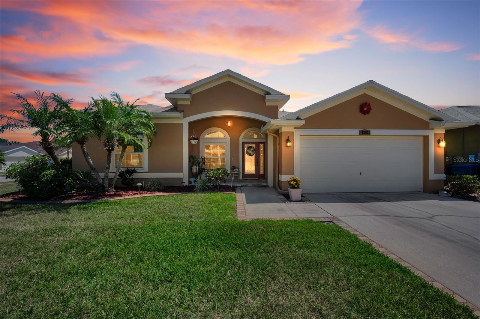 This lovely custom pool home is in the desirable Wild Oaks neighborhood built in 2005. It is a three-bedroom, two bath, two car garage home. It is situated on a large, landscaped corner lot offering great curb appeal. 0 scaping in the back pool area.  Just jump in and enjoy without any headaches.  Step through the beautiful glass front door into the pleasing foyer and take in the wonderful features of this home that include spacious ten-foot ceilings, stylish crown molding, transom windows, wood look tile flooring, and arched doorways. There is a formal dining room at the front of the home with an open doorway to the kitchen that features granite countertops, wood cabinetry, and a breakfast bar. The kitchen is open to the family room and has a wonderful fireplace. There is also a dining area off the kitchen with French doors that lead to the pool / lanai area. The pool area has a screened enclosure with deck space and a covered area, perfect for entertaining friends and family, and the pool features a relaxing waterfall. The back yard is fenced with white vinyl and has easy to maintain landscaping. The spacious primary bedroom offers a walk-in closet and an additional built-in closet; it also has French doors that lead to the pool area. The primary bathroom features a double sink vanity, a bathtub and a separate shower and a water closet for privacy. Off the hallway to the garage entrance is a wonderful laundry room with cabinets for storage. On the opposite side of the home are two additional bedrooms and the hall bath. The roof is three years old and there are some impact-rated windows, and the remaining windows have been treated with hurricane film. Located in central Pinellas County, this gorgeous home is near plenty of shopping, restaurants, banking, and medical services. Tampa international airport is 25 minutes away, Clearwater/St. Petersburg Airport is 15 minutes away, and if you want a beach day, Indian Rocks Beach is only about a 15-minute drive. Your perfect home awaits in Wild Oaks - schedule a private tour today!