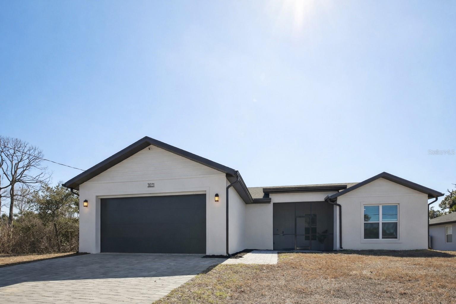 UPDATED PRICE!, Welcome to 3031 Bellefonte Ave, North Port, FL — a thoughtfully crafted 2024 concrete block home offering 1,701 square feet of refined comfort and long-term durability in the heart of North Port.
Built with quality in mind, this newly constructed residence features conventional 2x8 roof framing (16” OC), spray foam attic insulation, and an impressive 2.4 ACH50 blower door score—delivering exceptional energy efficiency, superior humidity control, and a noticeably quieter interior. Every detail was designed to provide lasting performance and peace of mind.
Inside, the open-concept layout creates an inviting atmosphere perfect for everyday living and entertaining. The kitchen serves as the centerpiece, showcasing a stunning waterfall quartz island, upgraded appliances, and seamless flow into the main living space highlighted by a custom built-in media wall.
The primary suite offers a private retreat with floating LED-lit vanities and a spacious walk-in shower, blending modern design with spa-like comfort.
Additional premium features include:
PGT impact windows for safety and storm protection
Enclosed lanai and front porch for expanded living space
Insulated 2-car garage door
Dedicated mini-split A/C system in the garage
This is more than new construction—it’s a carefully engineered home built for efficiency, durability, and elevated everyday living. A rare opportunity to own a high-performance home designed for Florida living at its best.