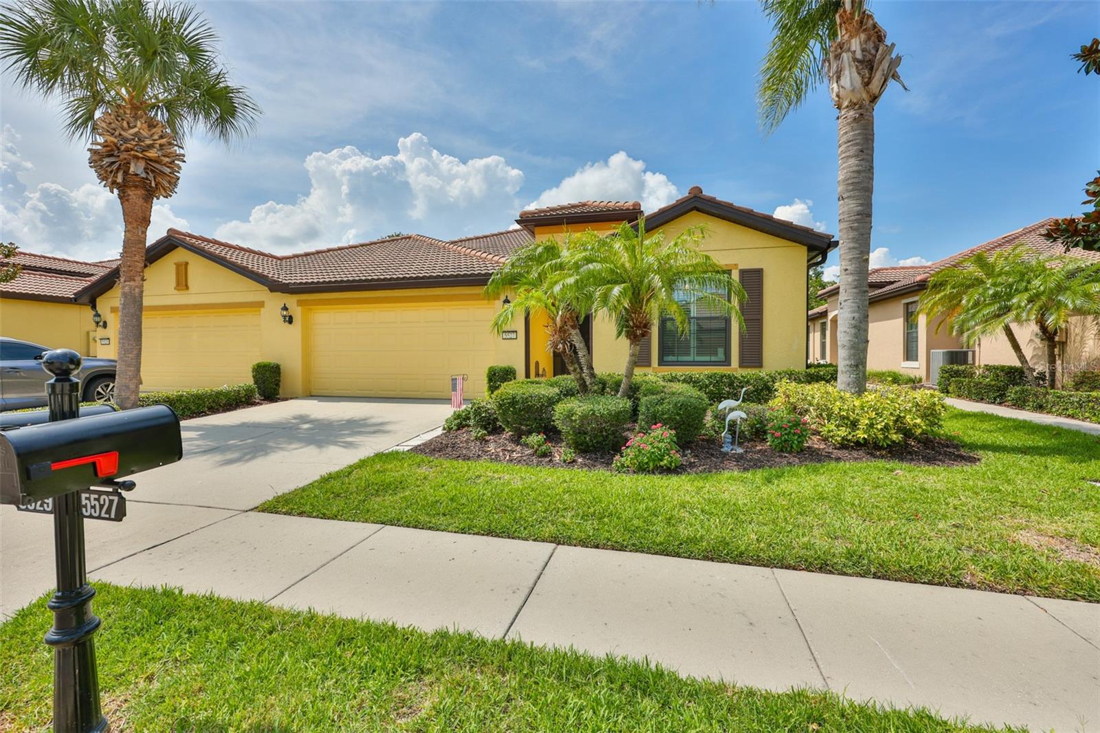 Here it is! Your chance to own a Piece of Paradise in Del Webb SouthShore Falls, a 24hr Gated Community! This Fabulous 1,523 sq ft 'Sea Spray' Villa model, with its own private front screened entrance and Extended Private Lanai with Built-in Cooking Station & Grill will show you... this one HAS IT ALL!  Built in 2013, it features 2 bdrms, 2 baths plus Office/Den/Flex Room, Gourmet Kitchen, Inside Laundry Room & 2 Car garage! The Newer HVAC(2021) & NEW PGT Hurricane +5 Impact Resistant Windows, keeps this home safe & energy-efficient!  Meticulously maintained, from the gorgeous Tiled floors & Engineered Hardwood(no carpet), to the Tall Ceilings accented with Crown Molding & has gorgeous Custom Plantation Shutters on all windows, this home with open floor plan will 'WOW' you & capture your hearts!  You'll love the Gourmet Kitchen w/ Stainless Steel Appliances(2021), Sola-Tube Skylight, Tiled Back Splash (under cabinet lighting), Granite Counters, Breakfast Bar w/ seating,42" Wood Cabinets w/ 2 Roll Drawers & there's a Pantry too! The Spacious Dining area flows into the Great Room(2 ceiling speakers & 2 outside) on the fantastic extended Lanai, where you love entertaining! The Triple sliding doors from great room, step to Lanai which includes a built-in cooking station & the mobile grill is included! There is so much privacy overlooking mature trees & blooming landscaping. Other patio features: Ceiling fan, an outlet to accommodate a TV, a pass-thru covered outlet box for an extension cord to run a generator & 2 ceiling screen hatches. The Owners Suite has a Walk-in Closet is customized with Built-in IKEA shelving, En-Suite Bathroom with dual sinks & Tiled shower with seat bench & saftey bar! The Flex Room makes a perfect Office, Craft or Sitting Room! The split floor plan affords privacy, separating the Owner's Suite from guest bedroom and the Guest Bath with tub/shower is just steps away. The Laundry Rm has Washer/Dryer, custom cabinets & laundry/utility sink! The 2 car garage has a ceiling fan, auto opener with Bluetooth, Epoxy floor, a Built-in Ladder up to attic w/a reinforced floor for extra storage. Other features: Ceiling Fans thru-out, motion lighting, built in side shelves for entertainment center, Zap Cap, Metal Storm shutters, In wall pest system and owners have the home treated regularly for pests! Exterior painting is included with low HOA (No CDD's) SSF's has a Spectacular recreation area in a Vacation-Style setting with Lagoon Heated pool, Resistance Pool, Spa, state-of-the-art Fitness Center, Water Aerobics, Bike Club, Walking Trails, Golf putting greens, Bocce & Pickle Ball & Tennis courts, Arts and Crafts, Billiards, Library, Card Clubs, Internet café & so many daily activities and Entertainment in the Expansive Clubhouse! Pets Welcome!  Very close to World Renowned Sugar Sand beaches in any direction, Golf Courses, a public boat launch, Freedom Boat Club, Tampa Bay City Life, International Airports & Hospitals. So, Come on, get away from it all at Del Webb SouthShore Falls Paradise and Live, Laugh, & Love Life!