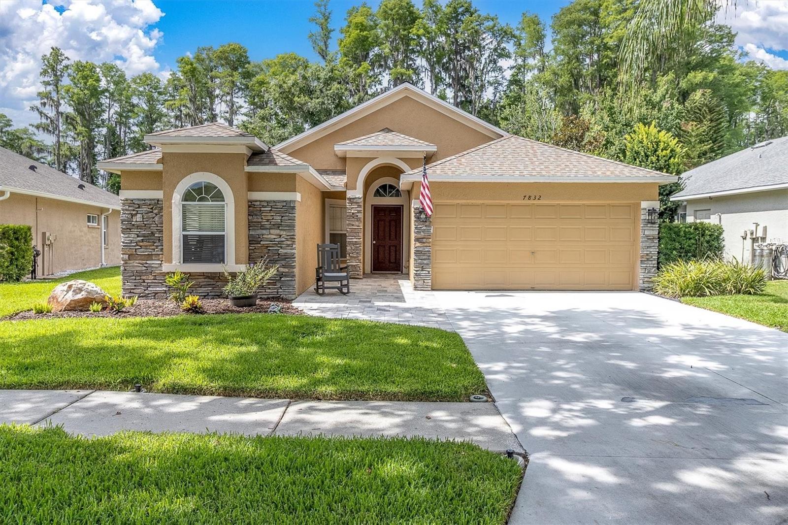 Looking for a real "Move-in-Ready home? This one is just hitting the market in the desirable Wilderness Lake Preserve in Land O'Lakes. This spacious home sits on a private cul-de-sac homesite with pavered driveway, new pavered walkway with sitting area leeds to the front door and beautiful new landscaping just enhance this home even more. Upon entering this spacious three bedroom, two bath home which features an open floor plan with an absolutely stunning NEW kitchen with all new stainless appliances, multi-purpose oven, convection oven microwave, porcelain sink, light fixtures in kitchen and dining room. Kitchen also features a breakfast nook and walk in pantry plus a huge center island for entertaining. Other additional items in this exceptionally well done updated home are new luxury vinyl flooring throughout this spacious home along with owners' ensuite bath featuring new shower and water closet. New neutral interior paint throughout will definitely save time, effort and money for the new owners too. Say hello to many family gatherings and friends parties with the upgrades that extend to the 500 square foot new panoramic screened and designer exterior flooring lanai area all overlooking a serene and beautiful scenic conservation area with new fencing that doesn't obstruct the amazing views....just say 'at last, we've found it!" Other newer items in this home are the water heater(2024), High efficiency A/C (2022) and roof (2022). Resort amenities  of Wilderness Lake Preserve include 2 fishing and kayak launch docks, nature trails, lagoon and heated lap pools, an outdoor party hot tub & sauna. The world class fitness center offers use of several Peloton bikes with views of the lake. There are tennis, basketball and sand volleyball courts, a 3-story treehouse playground, a fun nature center, a movie theater and many neighborhood events, including guest food trucks. There's even a nail salon! Access Red Bug Lake from the backyard and bring your canoe or Kayak and enjoy! Whether you prefer to curl up with a good book or partake of the many activities of the Wilderness Lake community, you’ll find this the perfect place. Don't delay, come see it today!
