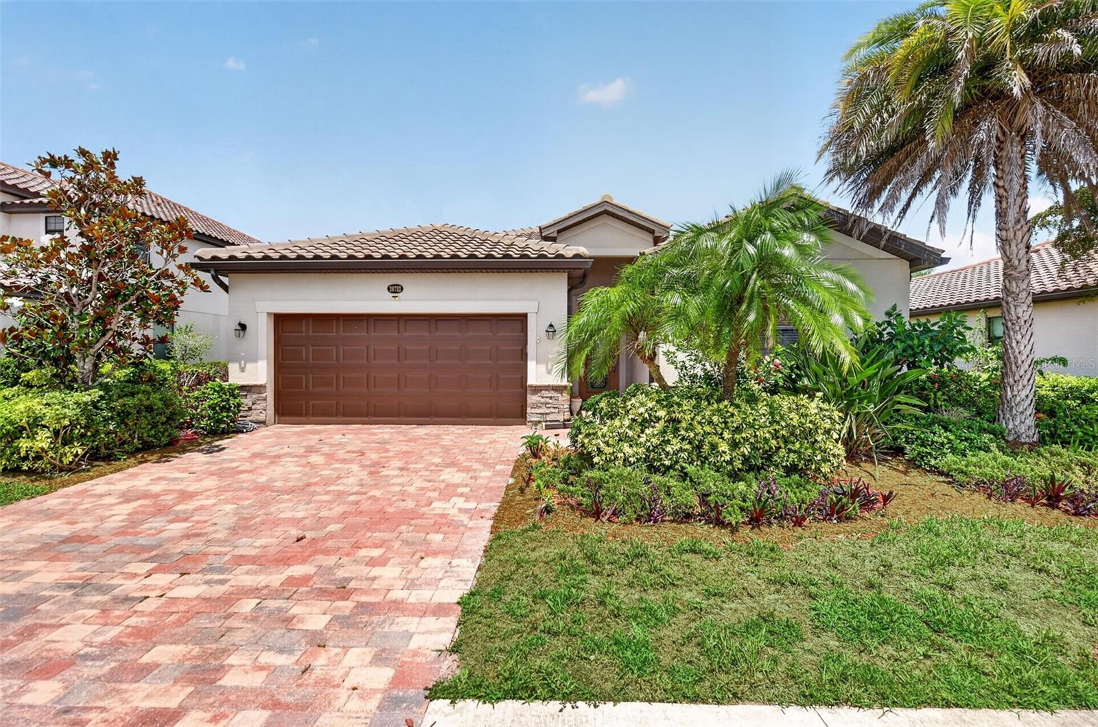 Welcome to resort-style living in Gran Paradiso, one of Venice's most sought-after Resort Style Gated Communities. This immaculate 4-bedroom, 3-bathroom Trevi floor plan home features an open-concept great room flowing into a chef's kitchen with granite countertops, full-height wood cabinetry, stainless steel appliances, and an expansive center island with seating for four. The owner's suite is privately positioned from the guest bedrooms and boasts double vanities, a walk-in shower, a soaking tub, and a walk-in closet. Crown molding, ceramic tile throughout the main living areas, and a 2-car garage complete the package, while the extended lanai offers breathtaking lake views and plenty of room to add a private pool.

Gran Paradiso elevates everyday living with a large, heated community pool and spa; tennis and pickleball courts; a state-of-the-art fitness center; saunas; steam rooms; a billiards room; and a year-round calendar of clubs and activities, all within a 24-hour gated, resort-style maintenance-free community. Minutes from Gulf Coast beaches, The Atlanta Braves Spring Training Complex, The New Wellen Park Development, Downtown Venice, Hospitals, Banks, Restaurants and an easy drive to Sarasota and St. Armand's Circle, this home truly has it all.

Located just minutes from the master-planned community of Wellen Park, home to the State College of Florida Collegiate School and a brand-new Sarasota County public high school slated to open for the 2026–2027 school year. When it comes to everyday convenience, this location delivers, a Costco Warehouse offers bulk shopping, fuel, pharmacy, and optical services, while the nearby Aldi brings fresh produce, quality groceries, and exceptional value, all within a 10-minute drive.

Note for Buyers: The property tax amount includes the CDD.