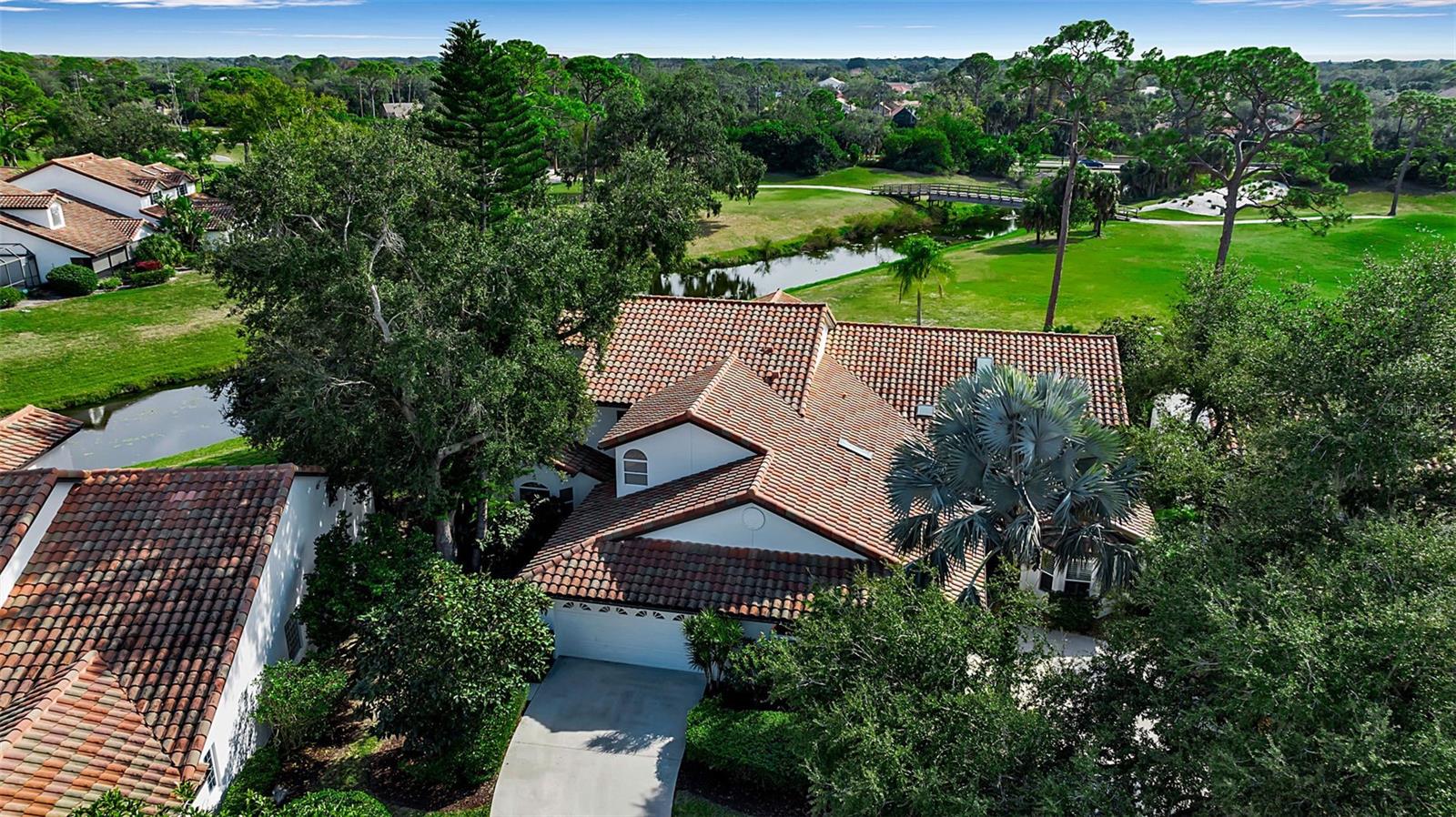 RECENTLY REDUCED AND READY FOR YOU! This stunning 3 bedroom, 2.5 bath home located in the Villa Palmeras section of Prestancia features unique water and golf course views that unfold throughout the home. From the moment you enter, the soaring great room creates an unforgettable first impression with natural light pouring in. Seamless indoor-outdoor living awaits as sliding doors open to the screened-in lanai, perfect for morning coffee or sunset gatherings overlooking the shimmering water, the 15th tee, and even an active Bald Eagle’s nest! The property is in pristine condition, maintenance-free, and just 50 yards from the community pool. If you seek a carefree Florida lifestyle, look no further. Situated in Palmer Ranch, you are close to everything – shopping, golf, tennis, restaurants, beaches and the interstate. Enjoy all the area has to offer, then return to relax in this beautiful home with true wow factor.
