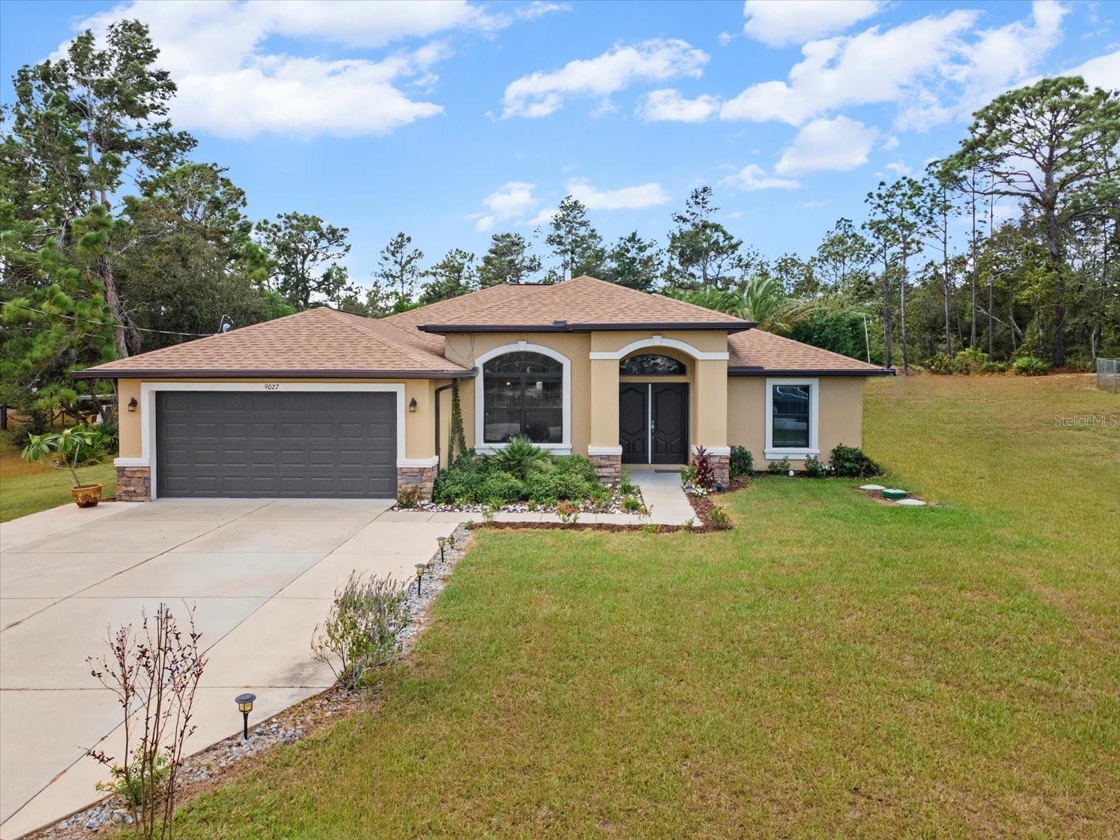 One or more photo(s) has been virtually staged. One or more photo(s) has been virtually staged. UNDER APPRAISED VALUE! This isn’t just a house… it’s the kind of backyard setup that makes every other pool home suddenly feel a little forgettable. Built in 2021 and sitting on .55 acres with NO HOA, this 3-bedroom, 2-bath home with a den delivers privacy, style, and serious resort-style living.
Inside, everything feels light, bright, and effortlessly inviting. The open-concept layout was made for entertaining, relaxing, and pretending you casually live like this every day. The kitchen has upgraded cabinetry, granite countertops, stainless steel appliances, and enough space to host everything from brunches to late-night gatherings. The split-bedroom layout offers privacy where it counts, while the den gives you the flexibility for a home office, guest space, gym, or your own quiet escape.
Then you step outside… and that’s where this home really flexes. The resort-style lagoon pool with cascading waterfalls, lush tropical landscaping, and tranquil pond feature creates a backyard that feels more like a private vacation retreat than a home. The expansive deck, gazebo, and fully equipped tiki bar complete with mini fridges, kegerator, ice maker, and sink make this the ultimate setup for entertaining or simply enjoying Florida living at its finest.
The fully fenced yard offers room to spread out and enjoy your own private oasis, while two storage sheds add even more functionality.
This one wasn’t built for boring weekends!