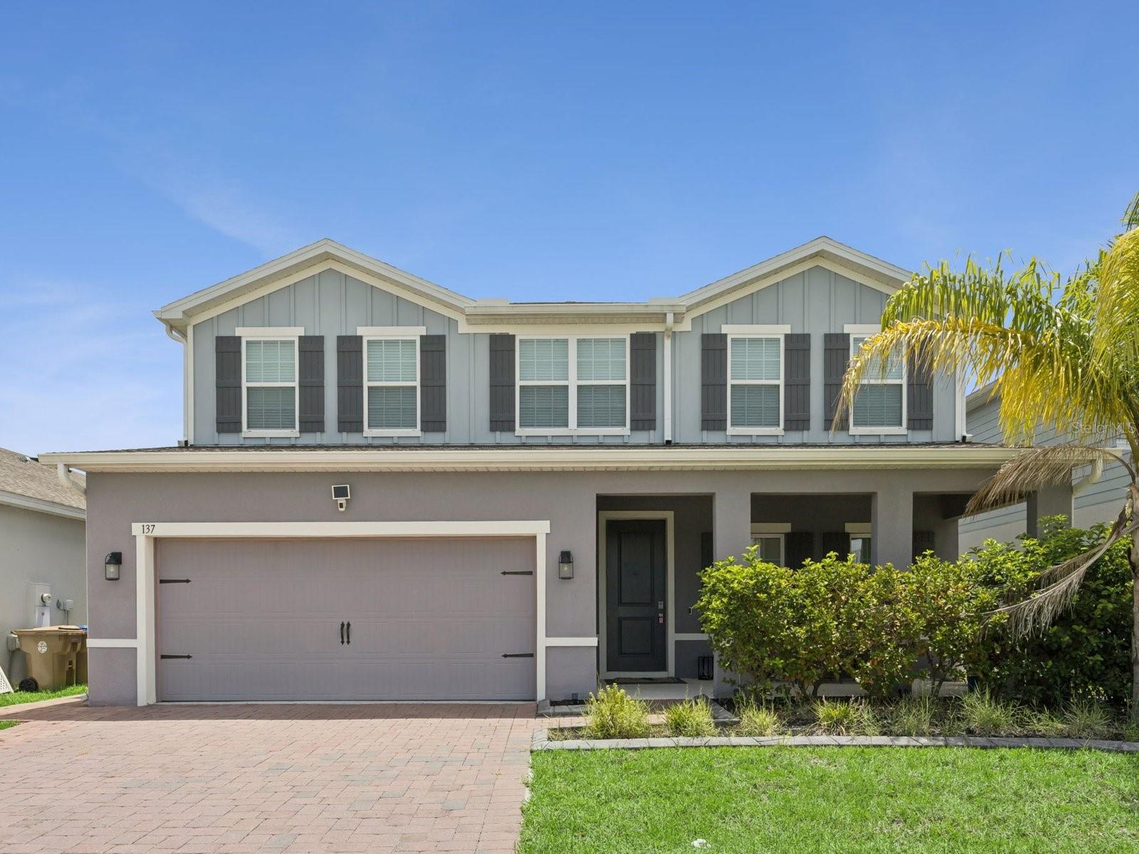 MOVE-IN READY! SAME-DAY SHOWINGS! Welcome to this spacious 2022-built home in Siena Reserve offering 5 bedrooms, 4 full bathrooms, 2,978 square feet of heated living space, an upstairs loft, and an attached 2-car garage. The open-concept first floor brings the kitchen, dining area, and great room together in a bright and functional layout designed for everyday living and entertaining. The kitchen features a large center island with seating, stone countertops, abundant cabinetry, a cooktop, built-in double ovens, microwave, dishwasher, refrigerator, and a walk-in pantry. Upstairs, the oversized primary suite includes two walk-in closets and a private bathroom with dual vanities and a spacious tiled shower. Additional highlights include tile flooring throughout the main living areas, carpeted bedrooms and loft, ceiling fans, an interior laundry room with washer and dryer, covered front and rear porches, a vinyl-fenced backyard, paver driveway, and generous garage storage. Siena Reserve offers community amenities including a pool, playground, dog park, sidewalks, trails, and green space, all in a convenient St. Cloud location near Narcoossee Road, Lake Nona, shopping, dining, schools, and major transportation routes.