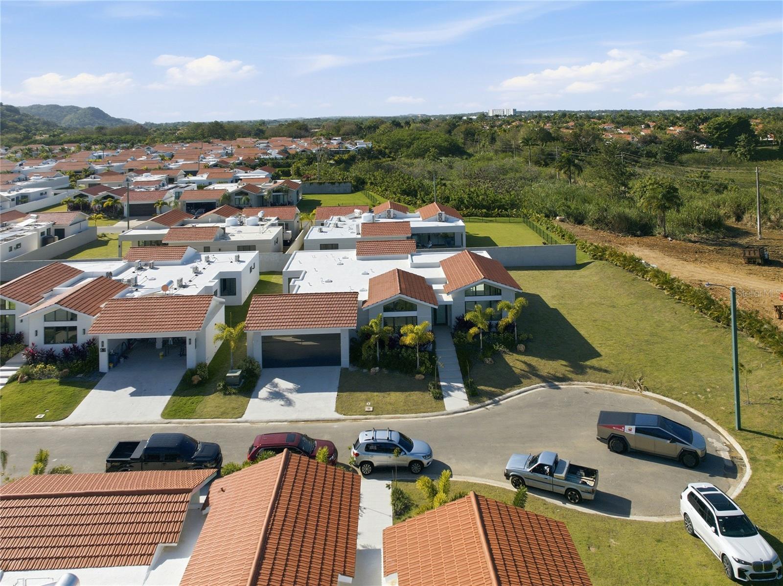 Located in Sabanera Dorado's Isla de las Flores, this Casona del Lago residence sits on an 11,256 sq ft (1,045.74 m² / 0.2661 cuerdas) cul-de-sac lot with direct access to the community's green areas.

New construction (2025), never occupied, and still under developer warranty. Single-level floor plan with approximately 4,000 sq ft of living space.

- 4 bedrooms / 4.5 bathrooms (4-convertible-to-5 layout)
- Master suite with walk-in closet and ensuite bath
- Studio/office
- Kitchen with pantry, open to dining and family areas
- Family room and gallery
- Covered terrace
- Two-car carport with storage

- **HOA:** $390/month
- **CRIM valuation:** Pending
- **Year built:** 2025
- **Lot size:** 11,256 sq ft (1,045.74 m² / 0.2661 cuerdas)
- **Living area:** ~4,000 sq ft
- **Bedrooms:** 4 (convertible to 5)
- **Bathrooms:** 4.5

- TASIS Dorado School within the community
- Clubhouse with resort-style pools, fitness center, and sports courts
- Lakes, jogging and biking trails, and green spaces
- 24/7 gated security