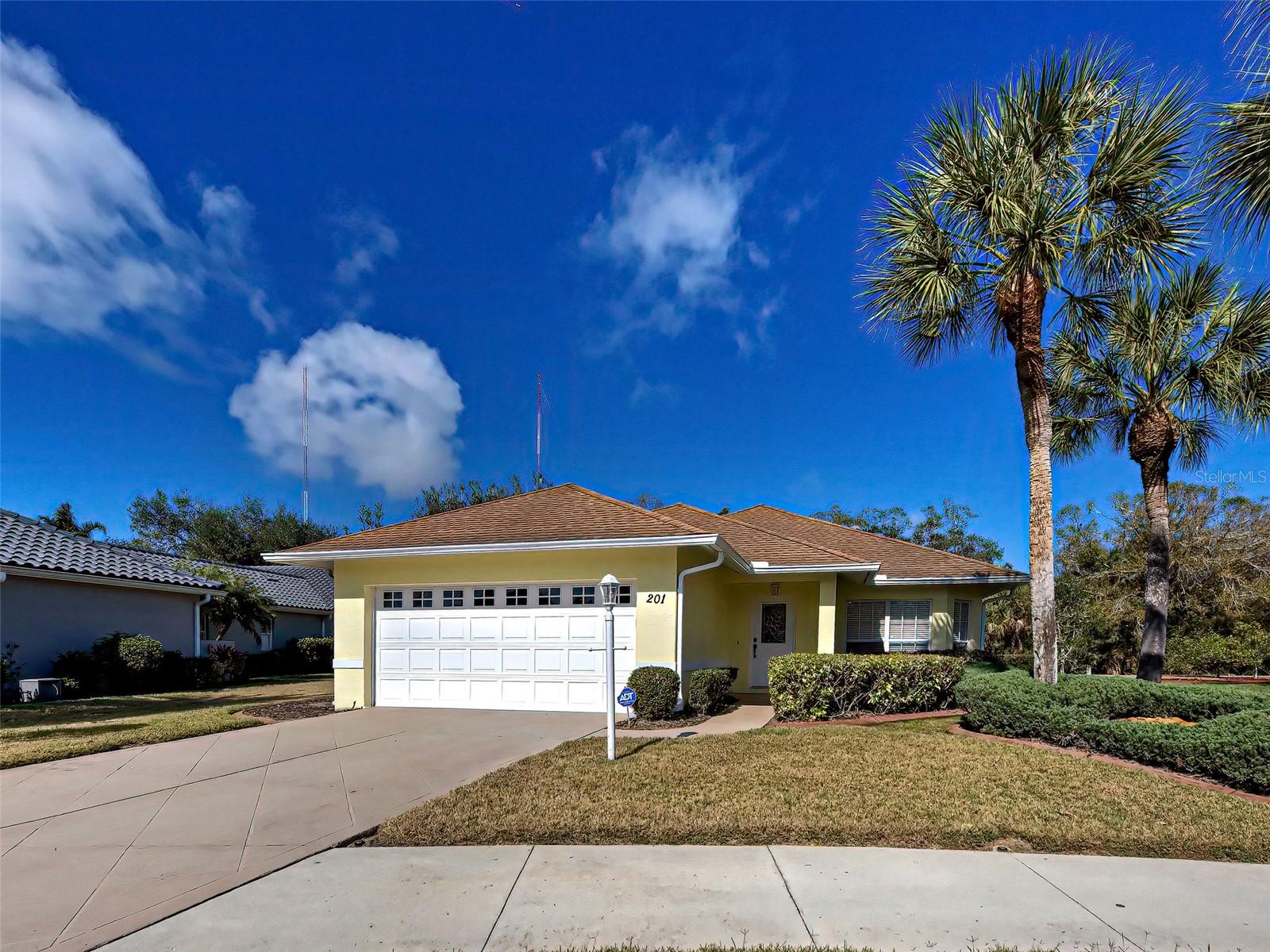 Enjoy breathtaking sunsets from your lanai overlooking the sparkling heated saltwater pool in this beautifully maintained single-family home. Located in the highly sought-after Venice Palms, Convenient to oh so many places, this move-in-ready home features 2 bedrooms, 2 full bathrooms, and a 2-car garage, with a spacious floor plan that feels even larger than its actual square footage. The remodeled kitchen is designed for both style and functionality, offering granite countertops, chef's island, abundant cabinet space, newer stainless-steel appliances plus a pantry for extra storage. The large living room features pocket sliders that open seamlessly to the lanai and pool deck, enhancing indoor-outdoor living. Designed for privacy, the split-bedroom layout includes a guest bedroom with an adjacent full bathroom. The primary suite is generously sized, featuring a walk-in closet plus an en-suite bath which is well-appointed with dual sinks and a spacious walk-in shower. This home has been thoughtfully updated and well cared for, featuring a newer roof (2018), AC (2022), refrigerator (2024), microwave (2024), dishwasher (2024), a freshly painted pool deck and epoxy flake flooring in the garage.  Located outside of a flood zone  this community is surrounded by natural preserves and a walking path offering a tranquil and picturesque setting. It's just a few miles from Downtown Venice where you'll enjoy convenient access to dining, shopping, entertainment, and the stunning Gulf of Mexico beaches. This move-in-ready home truly combines comfort, style, and practicality in one exceptional package. Don’t wait—schedule your private showing today and experience the best of Venice living!
