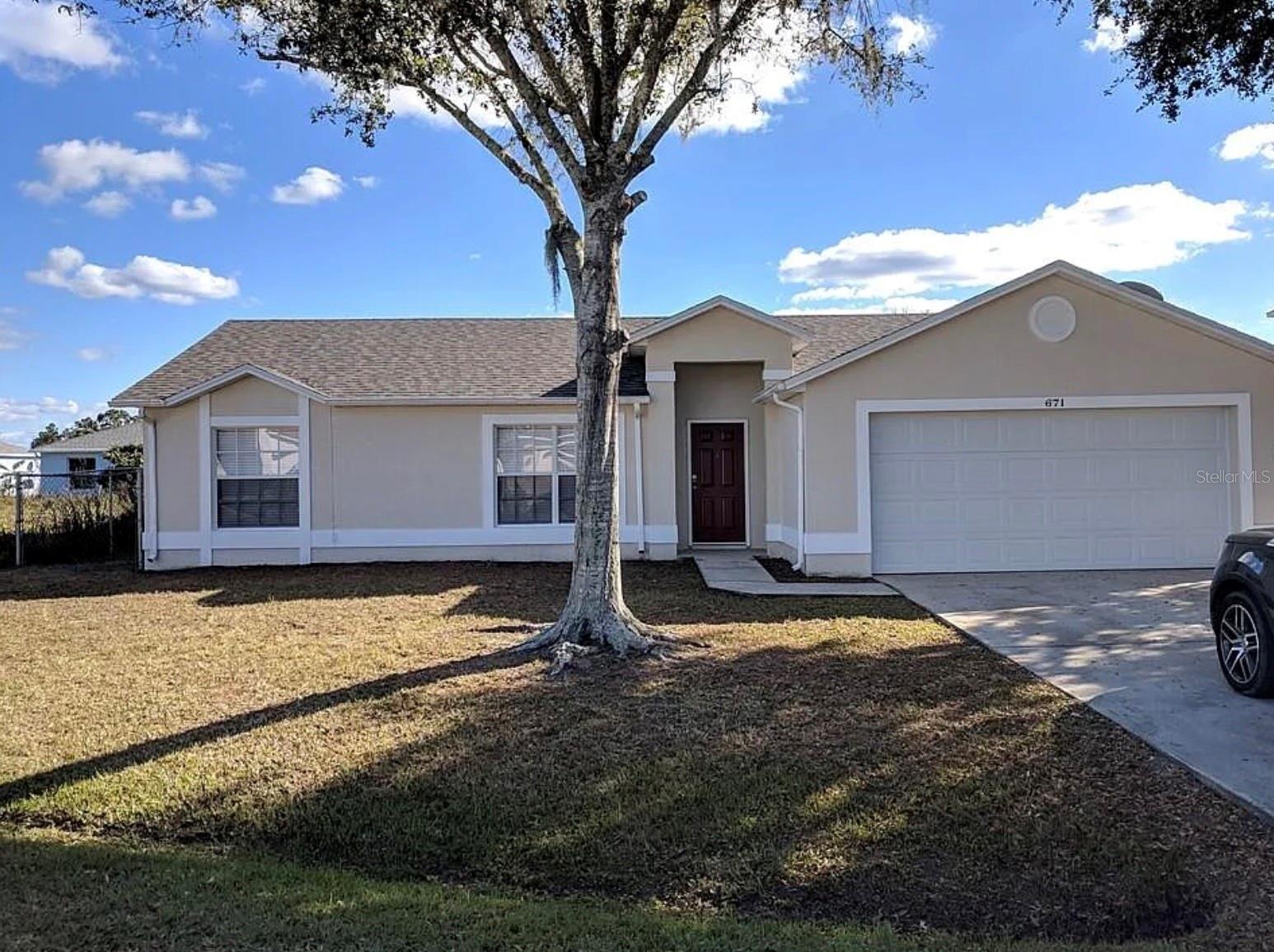 Move-in ready and full of value, this 3-bed, 2-bath single-story home sits on an oversized, fully fenced 0.29-acre lot in the established Poinciana community of Kissimmee. Easy single-level living with the primary bedroom on the main floor, ceramic tile throughout (no carpet!), central air, and a 1-car attached garage. The kitchen is fully equipped and ALL appliances convey — refrigerator, range, microwave, dishwasher, plus washer and dryer. Block and stucco construction, shingle roof, and located in Flood Zone X. Enjoy a generous lot with room to spread out, plus a quick commute to Hwy 17-92, shopping, dining, schools, and Orlando's world-famous attractions. A fantastic opportunity for first-time buyers and investors alike. Cash, Conventional, FHA, and VA financing welcome. Schedule your private showing today!