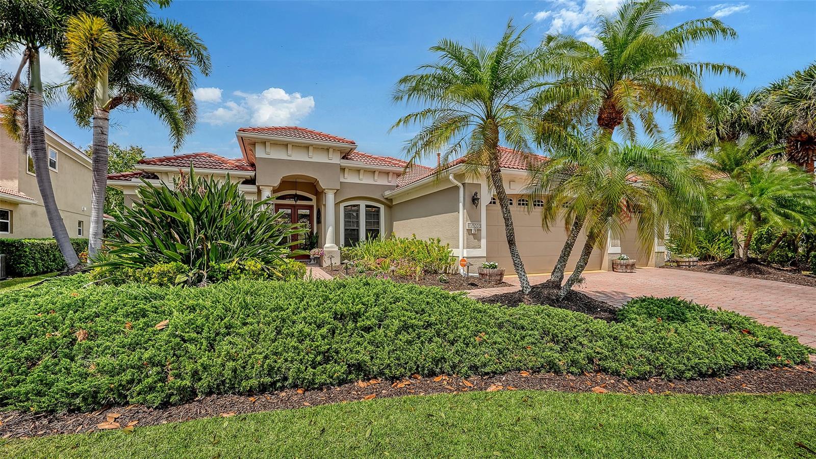 Move into this highly sought-after neighborhood of Greenbrook Preserve in Lakewood Ranch. Enjoy the benefits of low HOA fees on a larger lot (.35 of an acre) while living in a spacious 4-bedroom, plus office/flex space, 3-bath residence featuring a 3-car garage.  Built by renowned custom home builder Lee Wetherington, this home welcomes you with double glass entry doors, a tile roof, a paver driveway, and fresh mulch with vibrant flowers, all creating an inviting curb appeal. Enter to discover thoughtful architectural details, including recessed niches, crown molding, and tray ceilings, complemented by ceramic tile throughout. The chef’s kitchen is equipped with updated cabinets, stone countertops, stainless steel appliances, a walk-in pantry, and ample counter space, including a convenient breakfast counter, perfect for casual dining and entertaining.  This spacious home features more than four bedrooms, giving you the flexibility to design your ideal home office, entertainment room, or personal gym. The split floor plan ensures the primary bedroom remains quiet and private. In the primary suite, you'll find two walk-in closets with custom built-ins and a luxurious bathroom complete with dual vanities, a dedicated makeup area, a walk-in shower, and a relaxing soaking tub.  Step outside to the expansive lanai, thoughtfully designed for gatherings or peaceful escapes, featuring a saltwater pool and sun shelf. Enjoy the privacy of a large backyard adorned with mature landscaping creating a tranquil oasis you’ll love coming home to any day of the year. Greenbrook Village is located within the heart of Lakewood Ranch and is just moments from top-rated schools, the Premier Sports Campus, Lakewood Ranch Library, and convenient shopping and dining at the Mall at UTC and Waterside Place. Medical care, Sarasota and Tampa airports, and world-famous Gulf Coast beaches are all within easy reach.