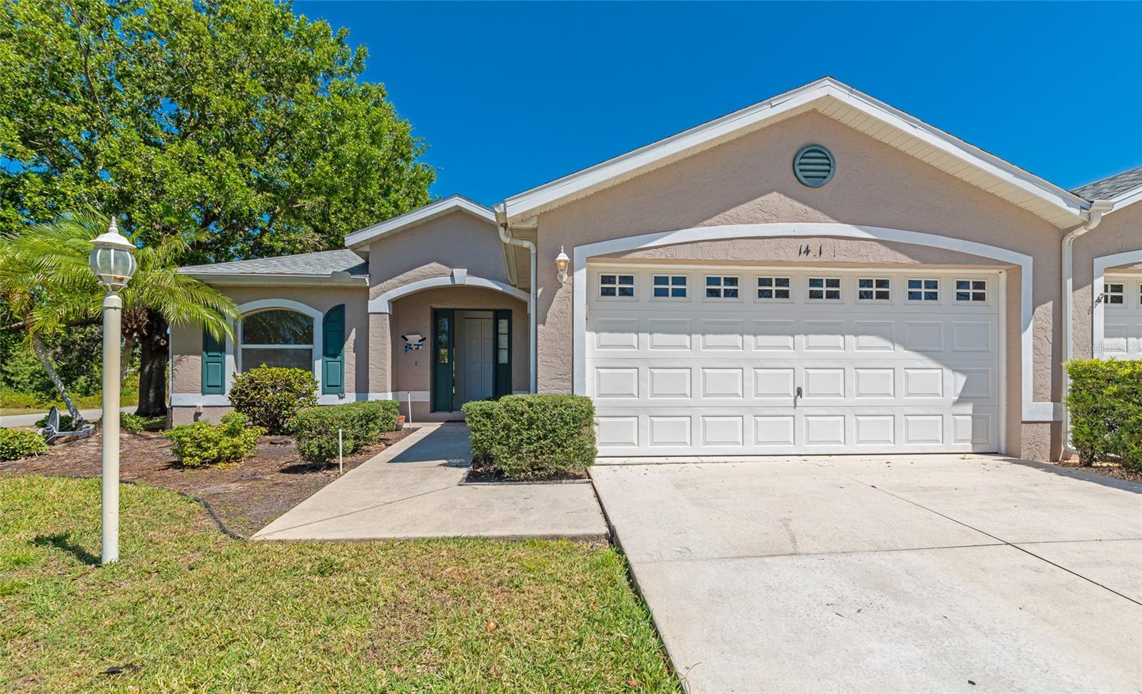 Renovated and Priced to sell fast. Experience move-in ready Florida living in this beautifully updated villa in Woodhaven Estates, where modern upgrades, low-maintenance living, and a prime central location come together. Situated on an oversized corner lot just shy of a quarter acre, this home offers peace of mind with upgrades including a new roof, HVAC and duct work. Inside, you’ll love the bright, open-concept floor plan enhanced by neutral designer paint, newer luxury vinyl plank flooring, and over 1,470 square feet of thoughtfully designed living space. Featuring 2 bedrooms, 2 full bathrooms, plus a versatile den, this flexible layout is ideal for a home office, guest space, hobby room, or even a personal gym, perfect for today’s work-from-home lifestyle. The heart of the home is the stylish kitchen, complete with shaker-style cabinetry, granite countertops, matching appliances, a breakfast bar for casual dining, pantry closet, and easy-care tile flooring. Overlooking the patio and lush backyard greenery, this space flows seamlessly into the dedicated living and dining areas, ideal for entertaining, hosting gatherings, or simply relaxing in comfort. The spacious primary suite serves as a private retreat with dual closets and an en-suite bathroom featuring his and her vanities and a luxurious walk-in shower with glass enclosure. A generously sized guest bedroom and nearby full bathroom provide comfort and privacy for visitors. To top it all off, the two-car garage and indoor laundry closet add everyday functionality and extra storage. Step outside to the fully screened lanai, the perfect spot for birdwatching with your morning coffee or evenings outdoors while enjoying the peaceful setting of your expansive corner lot. Residents of Woodhaven Estates enjoy desirable amenities including low monthly dues, a sparkling community pool and clubhouse, enhancing the active, maintenance-friendly Florida lifestyle. Currently tenant-occupied, this property offers rental income potential and presents a fantastic investment opportunity for years to come. Centrally located with easy access to I-75 and just minutes from everyday essentials such as, top schools, shopping, dining, and more. Come see this incredible opportunity before it is too late, schedule your private showing today!