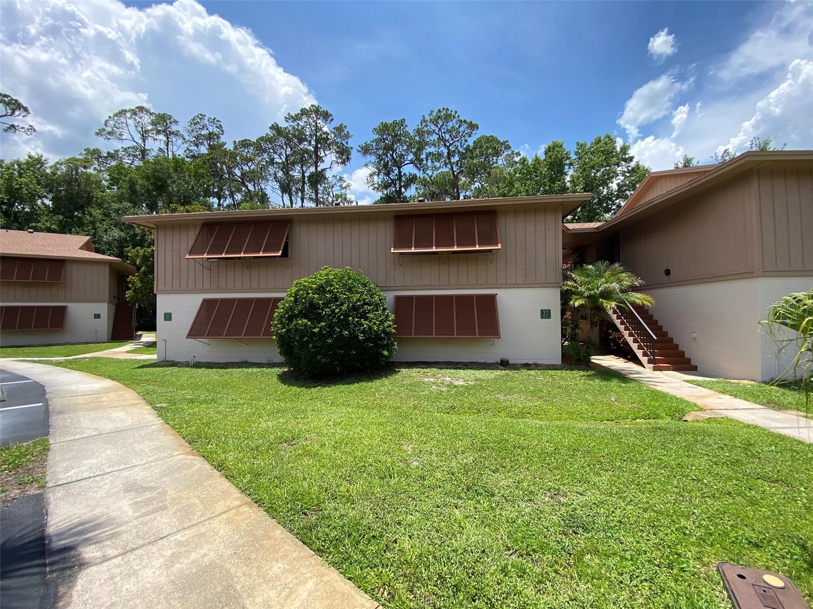 Great 2 bedroom 2 bath ground floor condo in Edgewater.  Backs up to wooded area with amazing wildlife just off the large screened patio. Active community with wide many amenities and social events.  Low HOA fees NO CDD.  Lots of open living space.  Floor plan connects the living and dining spaces with the kitchen. The kitchen offers ample cabinet and countertop space. The primary bedroom with a private bath and large built in closet while the guest bedroom has easy access to the hall full bath. In unit laundry with stackable washer/dryer included. Sliding doors lead out to the large covered screened patio which looks on to a peaceful wooded area. Edgewater has 2 community pools, tennis courts, recreation pavilion and access to miles of hiking and biking trails within waking distance! Very close to grocery store and shopping. St John's River, Lake Monroe, Downtown Sanford are just minutes away and Daytona and New Smyrna Beach are within 45 minutes. Quick access to I-4, 429 and 417 Beltways.
