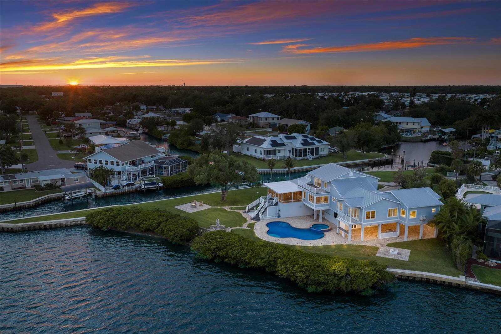 Welcome to a Rare, Private Peninsula Estate offering over an acre of prime waterfront living, where breathtaking panoramic views stretch across both canal and river waters. Tucked away at the end of a quiet street, this exceptional property delivers unmatched privacy, open space, and a true connection to Florida’s natural beauty complete with frequent sightings of dolphins and manatees just beyond your backyard.



Designed for those who value both luxury and lifestyle, the home features deep-water access with no fixed bridges, making it ideal for boating enthusiasts. The property has been extensively enhanced with a 700FT BRAND NEW SEAWALL , dredged waterways providing optimal depth for smooth navigation, a high-capacity boat lift 20,000 lbs  , and a dedicated jet ski lift 6,000 lbs, creating a turnkey waterfront experience. As an added exceptional BONUS, a custom 2021 Aviara BOAT IS INCLUDED, allowing you to immediately enjoy life on the water.



Inside, the residence captures stunning water views from nearly every room. The spacious layout includes multiple bedrooms with en-suite baths and balconies, soaring ceilings, and an open-concept design that blends comfort with elegance. The chef’s kitchen wolf appliances , with two refrigerators is equipped for entertaining, while expansive living areas flow seamlessly to the outdoor spaces. Smart home features include  whole house camera system. 



Step into your private outdoor oasis featuring a gas heated saltwater pool and 10 person Hot-Tub, an expansive lanai with built in smoker, and multiple areas and two different fire pits to relax or host gatherings , all framed by incredible sunrise and sunset views. Recent upgrades elevate the home even further, including NEW flooring, multiple NEW A/C systems, NEW renovated lanai enhancements following down to NEW Composite decking , ensuring long term durability and ease of maintenance, NEW garage doors, NEW exterior paint, and NEW upgraded enhanced landscaping lighting, ensuring both style and functionality. Use your own private beach to launch your kayak or paddleboard.



With its oversized lot, circular drive, split 4 car garage, and abundant space for entertaining, this property is truly one-of-a-kind. Located just a short boat ride to the Gulf and conveniently situated between Tampa and Sarasota, it offers the perfect balance of seclusion and accessibility.



This is not just a home it’s a waterfront sanctuary on a peninsula, where every day feels like a getaway.
Be sure to check out the virtual tour.