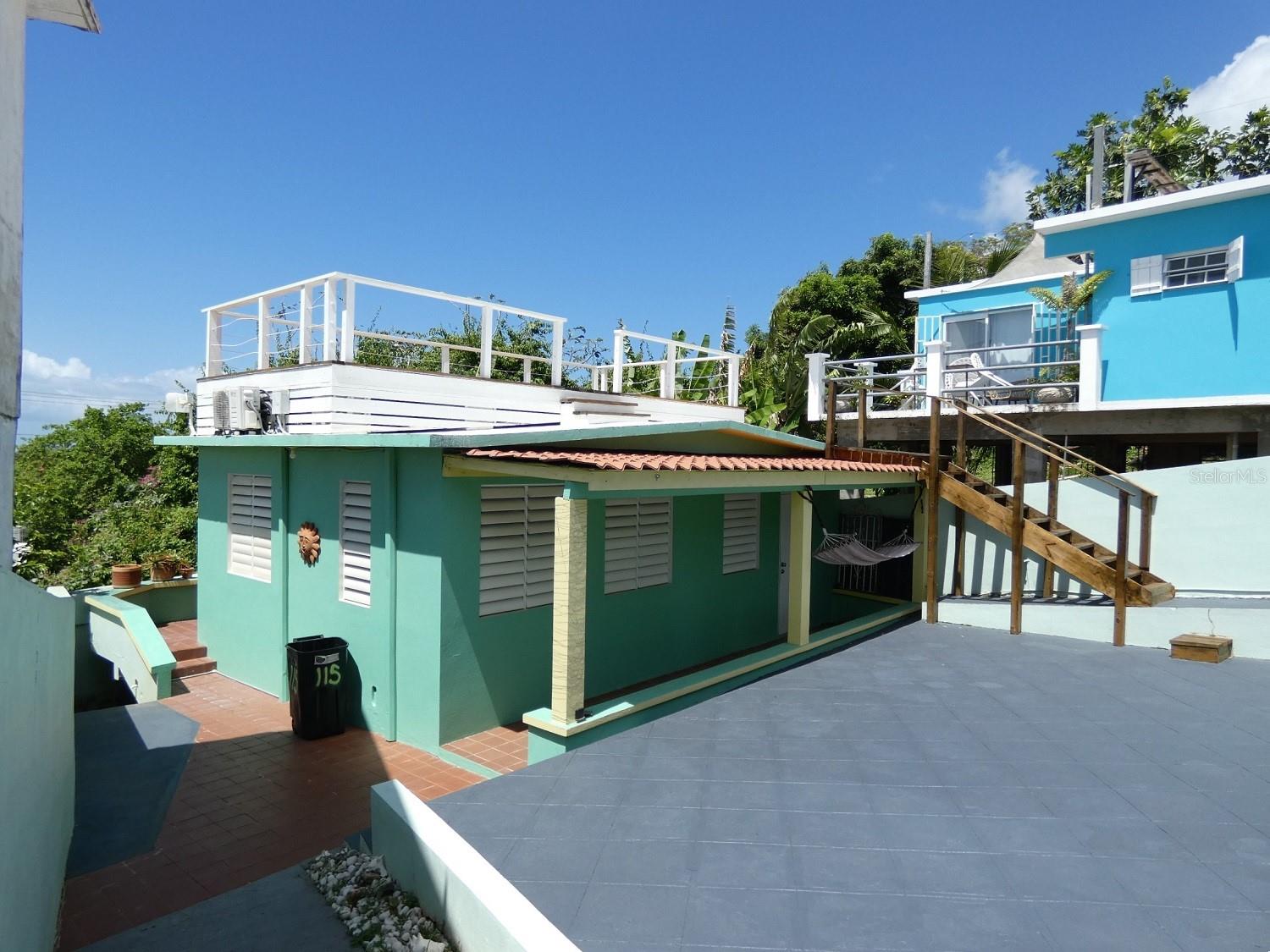 ADORABLE COTTAGE WITH VIEWS IN MAMBICHE!  Super cute one bedroom home on a 207.30 square meter lot in Mambiche.  Roof-top deck with views of the Ocean, the Fort, and the sunset and the stars.  Walking distance to restaurants, bars & shopping in Isabel II.  Solid concrete construction.  Modern cement counters, built-in couch & dining table.  Ceiling fans & air conditioning throughout.  Remodeled bath.  Full laundry & storage area just off the master bedroom.  Easy maintenance terraced front yard suitable for growing flowers, vegetables, or an herb garden.  Cement patio area (with access from master bedroom) for barbequing, exercising or just relaxing in the sun, as well as providing space for future expansion, or even a cocktail pool.  Sidewalk cut-out parking.  Perfect for quick getaways, or vacation rentals.  Fully furnished and move in ready.  Titled but not mortgage-able.  PRICE REDUCED!!!