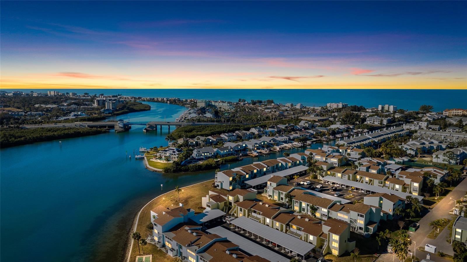 One or more photo(s) has been virtually staged. Great opportunity to live in a two bedroom condo in Indian Rocks Beach from under $300,000!!! This Waterfront Community is close to Indian Rocks Beach! Lots of recent updates!!! Entertain and just relax in this two-bedroom, two-bathroom condominium with a versatile Florida Room.  This residence also features an outdoor private courtyard located off of the dining room where you can relax, read a book, catch up on social media, or share time with a friend.  The kitchen has new stainless steel appliances and cabinets. Additional outdoor space, the rear patio area is accessible from the Florida Room.  The Florida Room offers flexible space where you could work from home, had some fitness equipment or add another dining or sitting area. The kitchen and both full bathrooms have been recently updated.  An added plus, is that the floors are tile throughout the condominium making clean up a snap giving you more time to love life. A separate living room has a cozy fireplace.  The covered parking space is located near the condominium making it easy to bring your groceries and other items into the condo.  There is a storage closet in front of the parking space for those outdoor, beach toys or other items you wish to store outdoors.  Additional updates include a water heater and new heat/air conditioner in 2025. This condominium is very conveniently located near the pool and clubhouse.