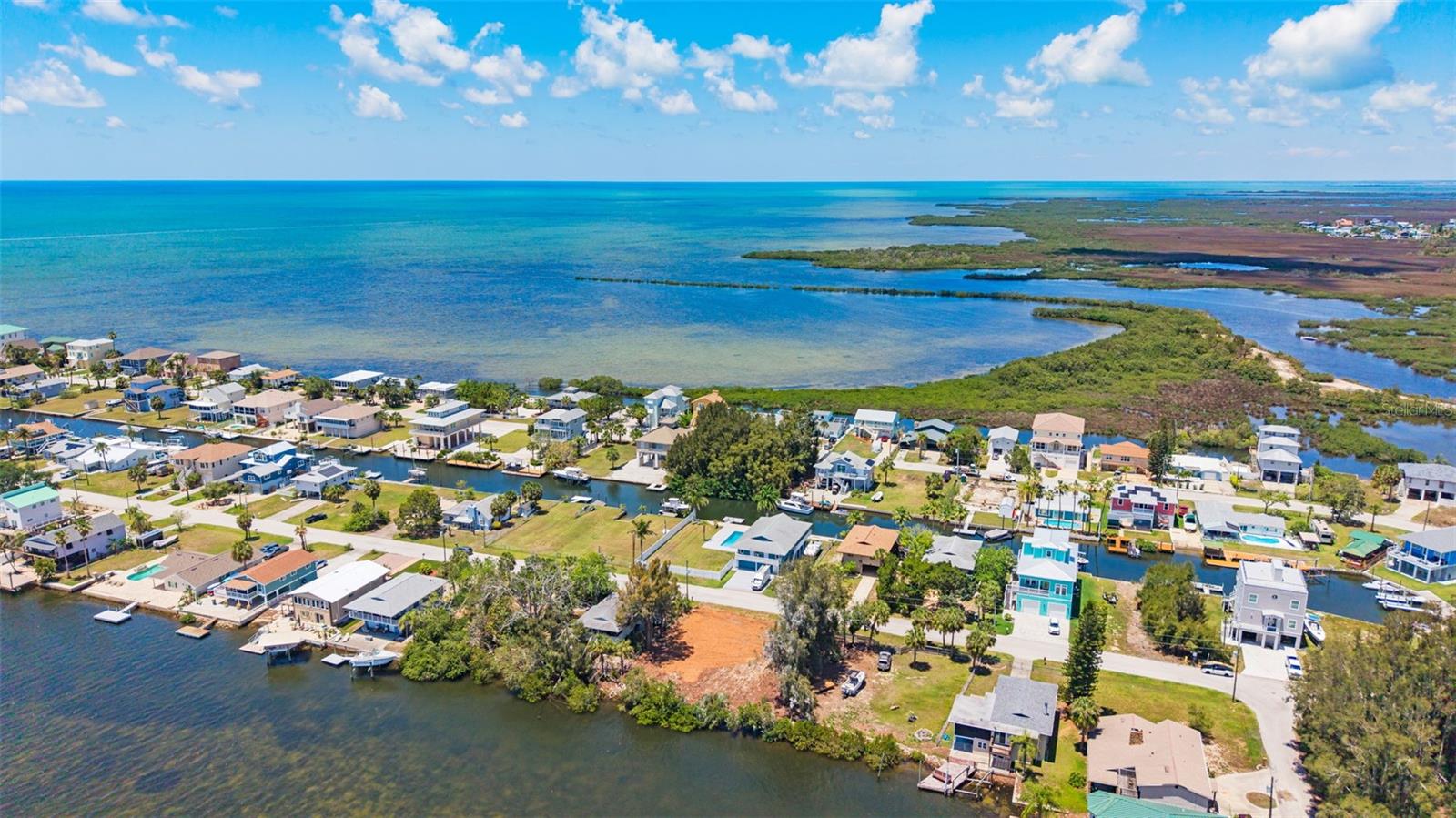 One of the largest waterfront lots in the area!  Build your dream home.  No better canvas than this oversized (yes, nearly 10,000sf!!), flat lot offering a rare 90 FEET of WATER FRONTAGE!  Welcome to 6646 Seaview Blvd in Hudson with direct Gulf access in just seconds, creating the perfect canvas to build your dream coastal home. Whether you’re planning a full-time residence or a relaxing weekend retreat, this property gives you the freedom to design exactly what you want, with no HOA restrictions on size or style.
Public water and sewer are available. Plans and builder options can be provided upon request to help you get started. Enjoy a prime location close to shopping, dining, and everyday essentials along US-19, while still embracing the peaceful waterfront lifestyle. Boating enthusiasts will love the easy access to the Gulf, including scenic trips to Anclote Island and waterfront restaurants. Conveniently located just 45 minutes from Tampa International Airport and about an hour from downtown Tampa, this waterfront community offers the perfect balance of relaxation and accessibility. Don’t miss your chance to secure a slice of Florida waterfront living—build your dream home today!