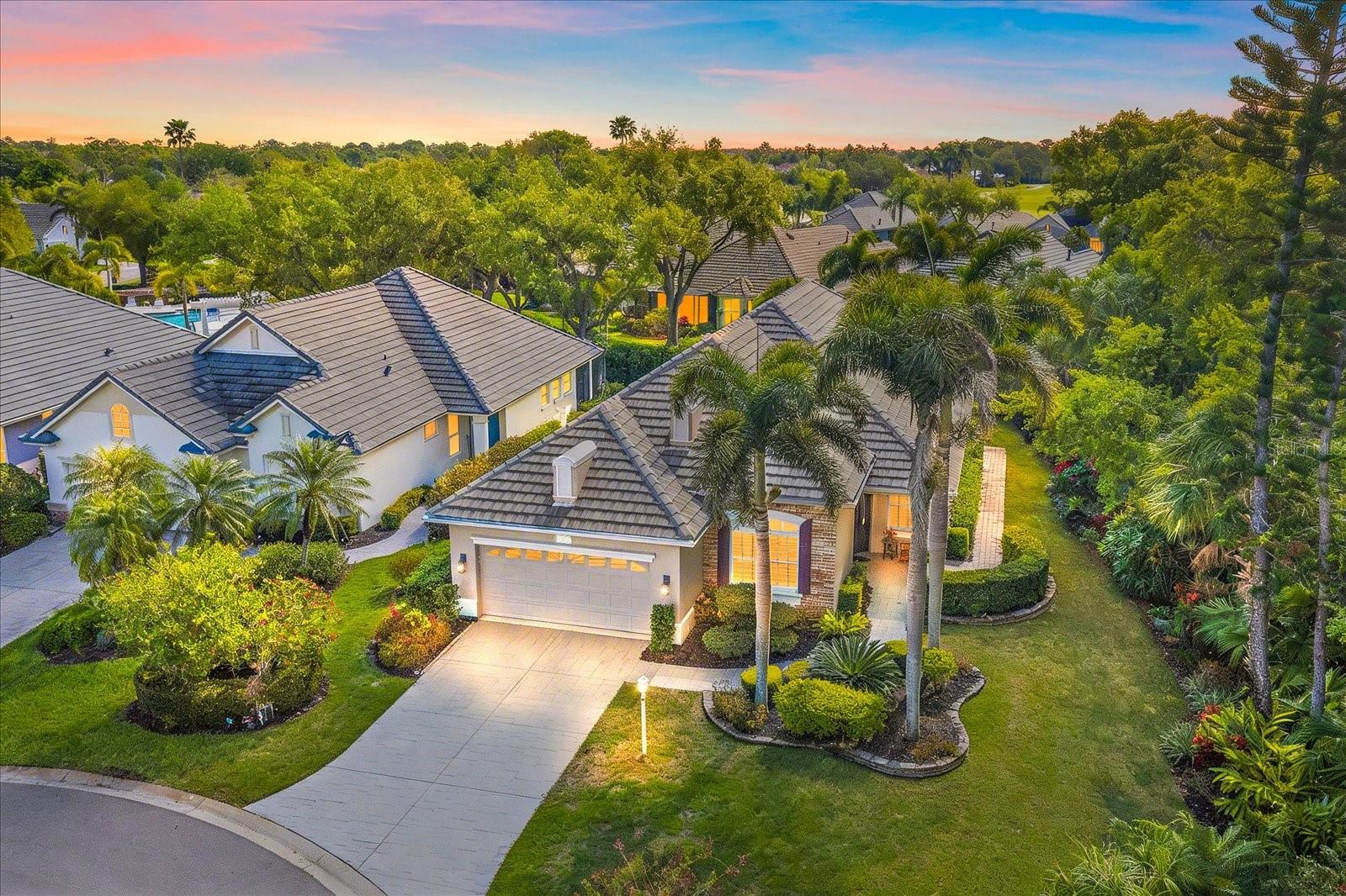 Maintenance-Free Living in Luxury! THIS IS A SHOW STOPPER! Tucked at the end of a quiet cul-de-sac on a private preserve lot in the GATED Lakewood Ranch Country Club! This is a BEAUTIFUL, MAINTENANCE-FREE, and COMPLETELY UPDATED home that truly has it all! From the moment you walk in, you notice the high ceilings, crown molding, and all the natural light coming through the hurricane-impact windows with plantation shutters. It feels open, bright, and just… right. The layout is fantastic.  3rd bedroom with engineered oak flooring—is currently being used as a den. The living room has custom built-ins and flows right into the kitchen, which is exactly where everyone will gather. The kitchen is done right—solid wood cabinets, soft-close drawers, pullouts, under-cabinet lighting, quartz countertops, farmhouse sink, Bosch appliances, gas range, and TWO pantry cabinets. The primary suite is spacious and comfortable with hardwood floors, a coffered ceiling, and a custom walk-in closet. The bathroom has marble finishes, dual vanities, and a large Roman shower with multiple showerheads. The guest bedroom has hardwood floors, and the guest bath is beautifully updated with wainscoting and a whirlpool tub. Step out back and you’ll love the screened lanai overlooking the preserve—quiet, private, and exactly what you want for Florida living. Morning coffee, evening breeze… it’s all there. Just around the corner, the community pool is the perfect place to enjoy your neighbors, relax in the sun, or get in a great workout. It’s like having your own resort just steps away. And the extras matter—Trane AC, tankless gas water heater, central vacuum, 8-foot doors, stained-glass entry door, and overhead garage storage. You’re in Lakewood Ranch Country Club, so you’re close to everything—golf, great restaurants, shopping, I-75, and about 30 minutes to the beach. Words and pictures cannot describe this home—you need to come see it for yourself. It is immaculate, updated, and private. LIVE ON VACATION NOW!