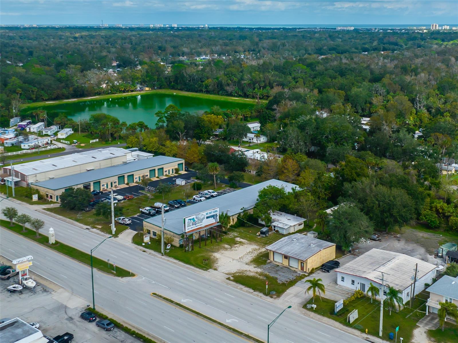 Great opportunity to own a 0.55 parcel zoned B-5 Service Commercial Zoning District in Ormond Beach, with 3 structures and a billboard located on the property.  The warehouse/garage building is 1,600 sq ft and is located on the far right side of the property.  There is a concrete block single family home to the rear of the property and a mobile single family home in the middle of the property.  Both single family homes have had long term tenants renting on a month to month basis.  Both single family homes will be ready for immediate occupancy by closing.  The billboard has a long term lease with a major local billboard company from 2006-2026 at $485/month + 25% of gross income (averaging $100-$150 additional per month).  This property has 4 potential revenue streams on it!  B-5 Service Commercial Zoning allows for the following permitted uses:  adult day care centers, assisted living, business & professional office, business service, convenience store, financing institution, funder home, retail sales, and warehouse storage business.  Buyers to verify all facts.  This property is offered in AS IS condition and will not last long!