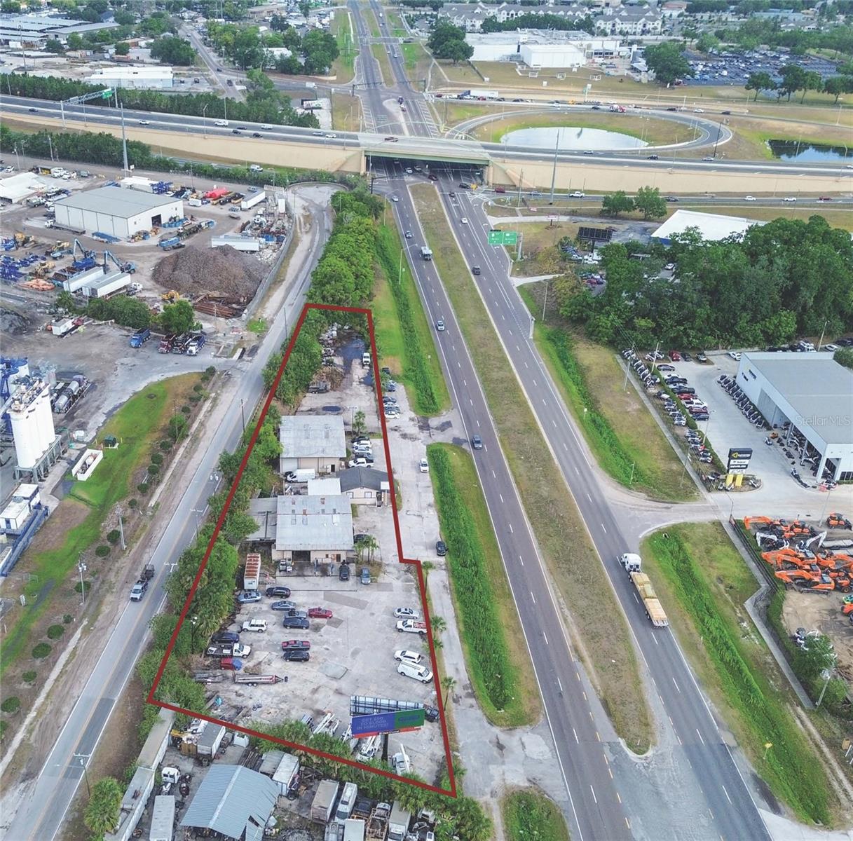 Exceptional industrial/commercial opportunity on 1.38 acres zoned I-4 Industrial, strategically located along busy Highway 441 with 700 feet of direct frontage and just 600 feet from the Highway 414 entrance ramp. This high-visibility site benefits from a daily traffic count of approximately 35,000 vehicles, offering outstanding exposure for existing and future businesses.
The property features 8,037 square feet of fully leased space, currently divided among three reliable tenants, providing immediate rental income. Additionally, a digital billboard on-site generates consistent advertising revenue, with potential for increased returns through updated leasing terms or expanded digital ad capacity.
With established ingress and egress, the site supports smooth traffic flow for both tenants and customers. Investors can continue operating with the current tenant base or unlock additional value by expanding the leased space, introducing new business operations, or developing additional commercial uses—such as storage units, flex space, or distribution facilities.
Located in a rapidly growing area with excellent highway access and strong traffic visibility, this property is a rare opportunity to secure a stable, income-producing asset with greater income growth.