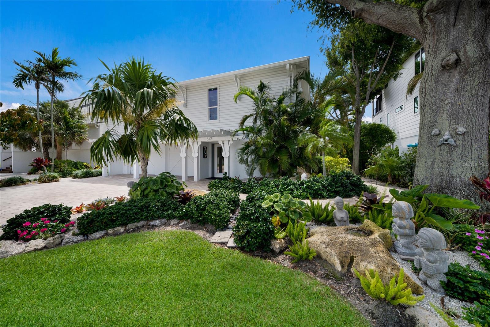 Welcome to Bamboo Bungalow, a rare canal-front island retreat showcasing timeless Old Florida charm on desirable Anna Maria Island. Perfectly positioned along a deep-water canal with quick access to Tampa Bay and the Gulf, this elevated 3-bedroom, 2-bath home offers the ultimate island lifestyle for boaters, kayakers, and beach lovers alike.

Natural light fills the bright, open-concept living space, where thoughtful updates blend seamlessly with the home’s character-rich design. The beautifully updated kitchen features solid wood cabinetry, a large island, pantry, wine refrigerator, stainless steel appliances, and a unique stained-glass accent window. The inviting living area is anchored by a wood-burning fireplace and enhanced by elegant crown molding throughout.

Recent improvements provide peace of mind and exceptional value, including a new roof and chimney, new seawall, updated kitchen and bathrooms, LED lighting, wood flooring, paver driveway and walkways, and a spacious new ground-level game and entertainment room.

One of the home’s most beloved spaces is the Florida room, where you can enjoy morning coffee, family gatherings, or evening cocktails while overlooking the tranquil canal. Watch manatees glide by and experience the relaxed waterfront lifestyle that makes Anna Maria Island so special.

The generous primary suite serves as a private retreat, complete with an en-suite bath and large walk-in closet. Two additional guest bedrooms are thoughtfully situated on the opposite side of the home, providing comfort and privacy for family and visitors. A dedicated laundry room offers additional storage, while the oversized two-car garage with epoxy flooring provides ample space for vehicles, beach gear, and water toys…and the must have golf cart! 

Step outside to enjoy the island breeze from the balcony, then follow the staircase to the expansive backyard. With plenty of room for a pool, the property offers endless possibilities for creating your own private tropical oasis. Mature, low-maintenance tropical landscaping enhances the home’s authentic coastal appeal.

Ideally located just a short stroll from world-famous beaches, Pine Avenue, local restaurants, boutiques, and island attractions, Bamboo Bungalow offers the perfect combination of waterfront serenity and walkable convenience. This amazing property is being offered turnkey furnished (including high-end furniture, decor, and art). 

Schedule your private showing today and discover the best of Anna Maria Island living.