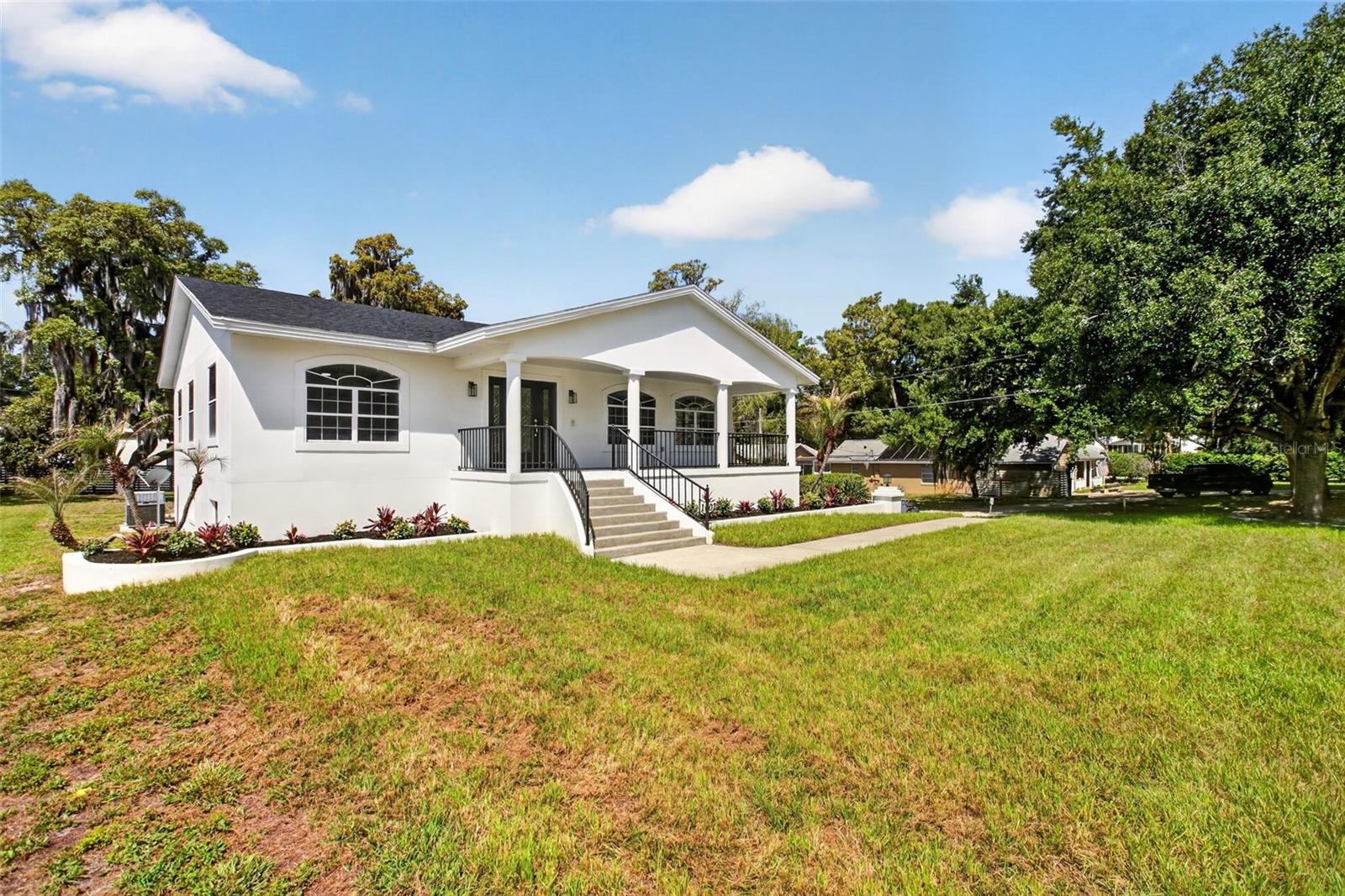 Set on a prominent corner lot in one of Windermere’s most sought-after enclaves, this thoughtfully updated residence blends timeless character with modern upgrades, enormous walk out bottom level, massive multiple garages and a lifestyle that is uniquely local to this area. Relax on the expansive front porch and take in the surroundings as neighbors and nature pass by.

Recent improvements include a new roof, a fully renovated kitchen, a designer-inspired primary bath, fresh interior and exterior paint, and newer engineered wood flooring, creating a cohesive, move-in ready home with a refined, modern feel. The layout offers expansive living spaces filled with natural light, designed for both everyday comfort and effortless entertaining.

The primary suite serves as a true retreat, highlighted by a beautifully reimagined bath featuring a freestanding soaking tub, custom tile work, and a double vanity. Additional living areas and a spacious lower level provide flexibility for a media room, home office, fitness space, or guest accommodations.

A rare offering in this location, the property features an impressive 3 bay, 30' long garage on one end and an additional garage bay on the opposite end of the home., ideal for collectors, storage, or workshop needs.

Positioned along historic Windermere’s signature tree-lined dirt roads, the setting offers a level of charm and privacy that is increasingly hard to find. Residents enjoy exclusive access to city tennis courts and a private dock with entry to the interconnected lake chain that surrounds this community, delivering a true lake lifestyle just moments from home.

Seller is offering up to a $25,000 closing cost credit, providing added flexibility and value for buyers.

A compelling combination of location, scale, and thoughtful updates—this is Windermere living at its best.
