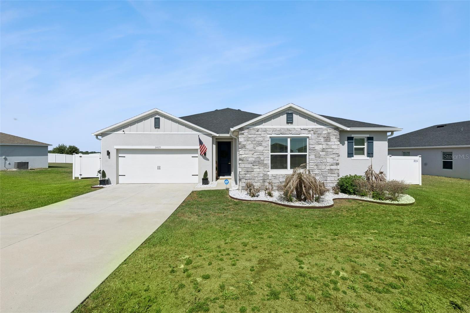 **This house comes with a REDUCED RATE through the seller's preferred lender. This is a lender-paid rate buydown that reduces the buyer's interest rate and monthly payment.**
Beautiful move-in ready home built in 2021, situated on a premium lot with no rear neighbors in the highly desirable Lake Jackson Ridge community. This tastefully updated 4-bedroom, 2-bath residence offers 2,334 square feet of living space, a 2-car garage, and shows like a model home. From the moment you arrive, you’ll appreciate the exceptional curb appeal featuring manicured landscaping and an elegant stone-accented front elevation.

Inside, the thoughtfully designed open floor plan showcases volume ceilings, abundant natural light, luxury vinyl flooring throughout, generous living areas, and peaceful outdoor views. The spacious kitchen combines timeless style and functionality with beautiful white cabinetry, upgraded quartz countertops, and modern appliances.

The primary suite serves as a relaxing retreat, complete with a walk-in closet, dual vanities, and a walk-in shower. Three additional bedrooms provide flexibility for family, guests, or a home office. Step outside to your fully fenced backyard oasis with pre-plumbing for future pool installation and a covered lanai overlooking serene green space — perfect for entertaining or unwinding in privacy.

Conveniently located in Gardens at Lake Jackson Ridge, this home is just minutes from downtown Groveland and Lake David, approximately 15 minutes from historic downtown Clermont with its popular dining, shopping, and entertainment destinations, and offers easy access to Highway 50, US-27, and the Florida Turnpike. Schedule your private showing today!