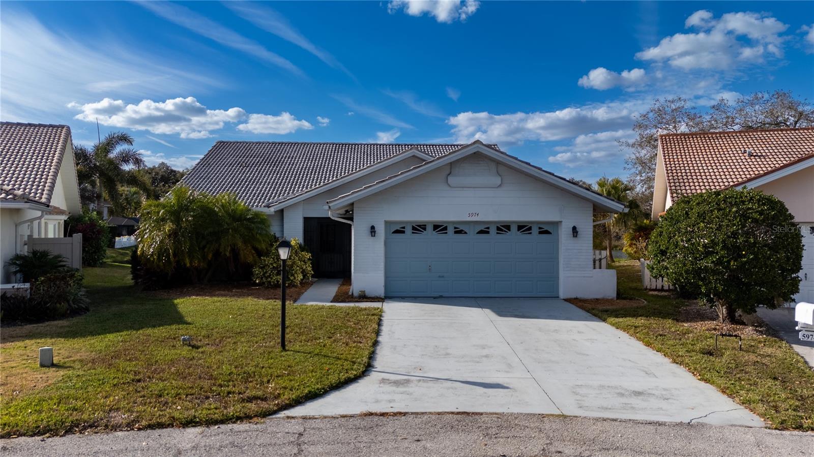 Seller will put on a New Tile Roof prior to closing!Experience serene lakefront living in this beautifully maintained 3-bedroom, 2-bath residence, thoughtfully designed as either a true three-bedroom home or a two-bedroom plus den to suit your lifestyle. Set on a tranquil lake, this home offers captivating water views and a peaceful backdrop where native wildlife and dreamy Florida afternoons take center stage.
A screened front entry welcomes cooling breezes throughout the home, creating an effortless indoor-outdoor flow without the nuisance of insects. Inside, the open, airy floor plan is filled with natural light and designed for both relaxation and entertaining, perfectly capturing the essence of Florida living. Located on a quiet cul-de-sac along San Michele in the desirable Longwood Run community, this home enjoys a prime position along the University Parkway corridor—minutes from Sarasota’s world-class beaches, SRQ International Airport, downtown Sarasota, and Main Street Lakewood Ranch.
Additional highlights include low annual HOA fees and a flexible rental policy allowing a minimum six-month lease once per year with no waiting period. Offered as the owners relocate to be closer to family, this is a rare opportunity to own a stunning lakefront home in an exceptional Sarasota location.