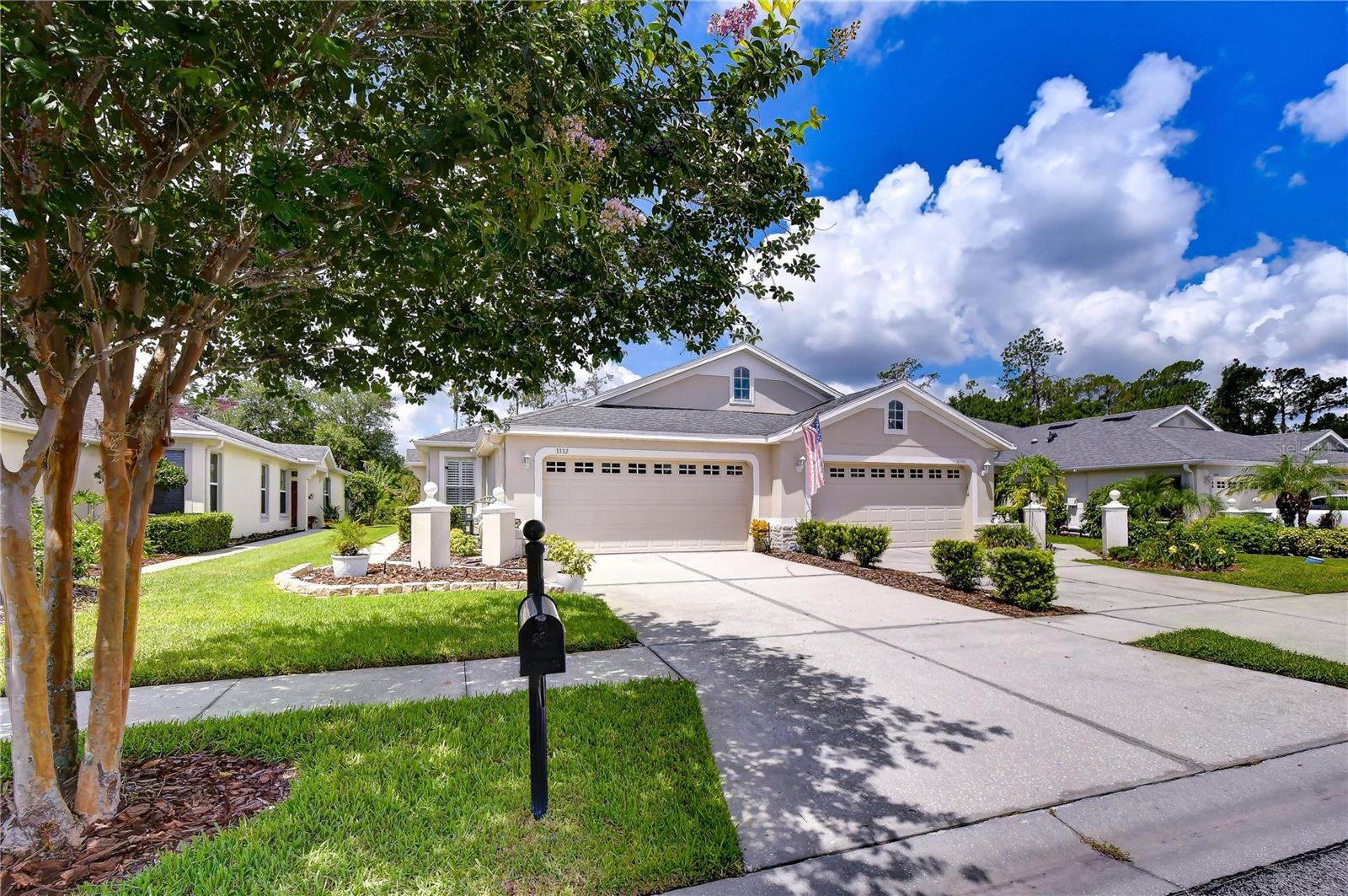 Welcome to this beautifully maintained MOVE-IN READY 3-bedroom/2-bath, attached villa with a 2-car garage and stunning POND/CONSERVATION VIEWS in the gated village of Willow Creek/Seven Oaks. With private side entrance, the villa offers the perfect blend of comfort, convenience, and low-maintenance living. The thoughtfully designed split bedroom floor plan features a spacious living area (can also be a living/dining combination), an abundance of natural light and a seamless flow that's ideal for both everyday living and entertaining. The well-appointed, updated kitchen features professionally painted white cabinets, granite suede countertops with a complementary backsplash and closet pantry with solid shelves. The extended primary bedroom with tray ceiling includes a walk-in custom closet plus a second closet. The recently updated primary bath with garden tub and walk-in shower with grab bars is complete with granite countertops and two mirrored cabinets over the undermount sinks. Two additional bedrooms offer flexibility for family members, guests, or a home office. Relax on the expansive screened and covered lanai as you take in the sights and sounds of nature and spectacular sunsets. Storage galore in the two-car garage - all built-in cabinets and shelving convey! Additional features include Plantation Shutters, contemporary lighting and water softener. Main Roof 2019; Lanai Roof 2022. Willow Creek has its own community pool and owners also enjoy the resort style amenities at the Seven Oaks Club including pools, tennis, pickleball, fitness center, splash pad, basketball court, playing fields and spacious clubhouse. The growing Wesley Chapel area is bustling with shopping (Wiregrass and Premium Outlet Malls), a multitude of dining options, medical facilities, Baycare/Advent Health hospitals and coming soon - Whole Foods. Seven Oaks affords easy access to I-75 and I-275 making commuting throughout the Tampa Bay area more convenient. The monthly HOA of $272.99 includes the Willow Creek community pool, grounds and landscape maintenance, roof, exterior painting, pest and weed control. Seller can close quickly! Don't miss the opportunity to own this impeccably cared for villa in the gated community of Willow Creek.