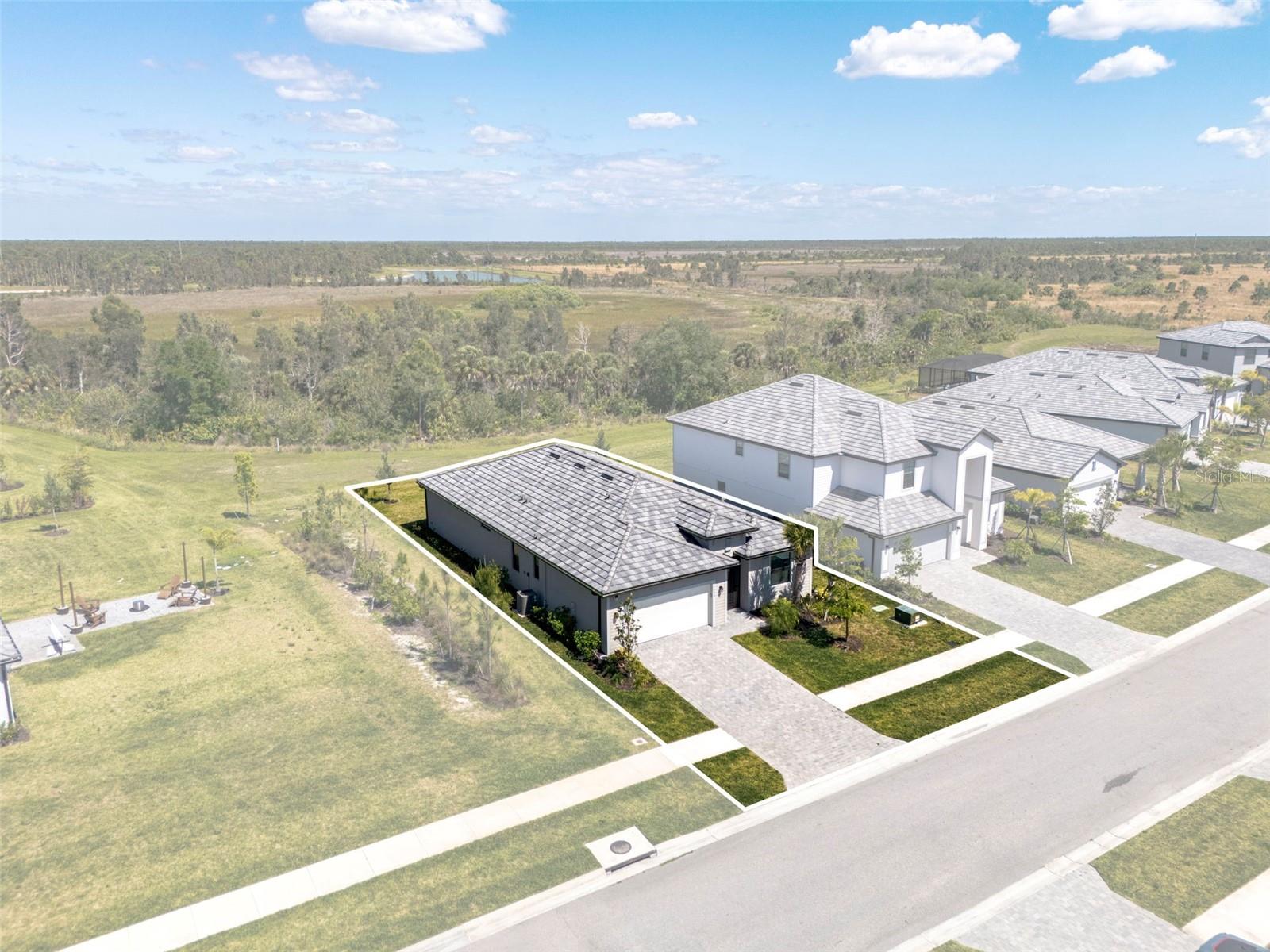 Located in Lakespur at Wellen Park. Ready NOW for the opening of the brand new state of the art Wellen Park High School! SELLERS ARE MOTIVATED AND OFFERING A ONE YEAR HOME WARRANTY!  This lot is located on a cul-de-sac in the established Phase I of Lakespur and in walking distance to the school. No need to deal with construction traffic and noise that comes with buying in a new phase. The Marsala is a popular 3-bedroom, 3-bath split floor plan offering generous entertaining space, a storage-rich kitchen with a large island, a private guest en-suite bedroom and bath and a versatile den that can serve as a 4th bedroom. The large primary suite is located in the back of the home and has two walk in closets and double sinks. An 11' sliding door with custom track blinds opens to a peaceful conservation preserve with ample room to add a custom pool. Known for its strong sense of connection and vibrant lifestyle this multi-generational community offers residents resort-style amenities including: a heated resort style pool with open-air kitchen, fire pit lounge, game lawn, dog park, and playground. A dedicated Lifestyle Director plans regular community events such as food truck nights, live music, cornhole tournaments, and poolside DJs. HOA fees cover high speed internet, cable and lawn maintenance.  INVESTORS: 30 day minimum leases are allowed four times a year so you can use this home as an investment property for people waiting to build or just trying out the area before they buy! 

Built in 2024 and lightly used as a meticulously maintained second home, it offers like-new condition without the hassle of construction. Impact windows and doors help keep energy costs and insurance low and lot is X flood which means you won't have to carry flood insurance. Upgrades include designer lighting and fans with auto sensors and dimmers, epoxy floors in the two car garage and a custom screened in entryway for you to enjoy the Florida breezes in the winter. Enjoy coffee and sunrise in your lanai, an afternoon dip in the heated resort pool, and a nightly sunset walk on the Oakheart Trail. 

Lakespur is highly desired due to it's proximity to the Manasota Beach extension to S. River Road, which has made travel to the shopping and dining area of Dearborn St and to Englewood Beach quicker.  Lakespur is a short golf cart ride to Downtown Wellen, Cool Today Park, Costco and Publix. Downtown Wellen is a vibrant mixed-use destination that brings together the best of shopping, dining, entertainment and education in Sarasota County. Overlooking an 80-acre activity lake, the area features restaurants, boutique retail shops, a food truck park, concert and festival spaces, a splash pad, and a dedicated play area. Beyond the downtown core, residents can explore The Landing Fishing Pier, Oakheart Nature Trail, Harvest Community Garden, and over 30 miles of scenic multimodal trails. Just minutes away, CoolToday Park—Spring Training home of the Atlanta Braves—hosts games and events year-round. All dimensions listed are approximate and buyer is responsible to verify if deemed important. CDD amount is part of listed tax amount and listed tax amount can change with transfer of property and applicable exemptions.