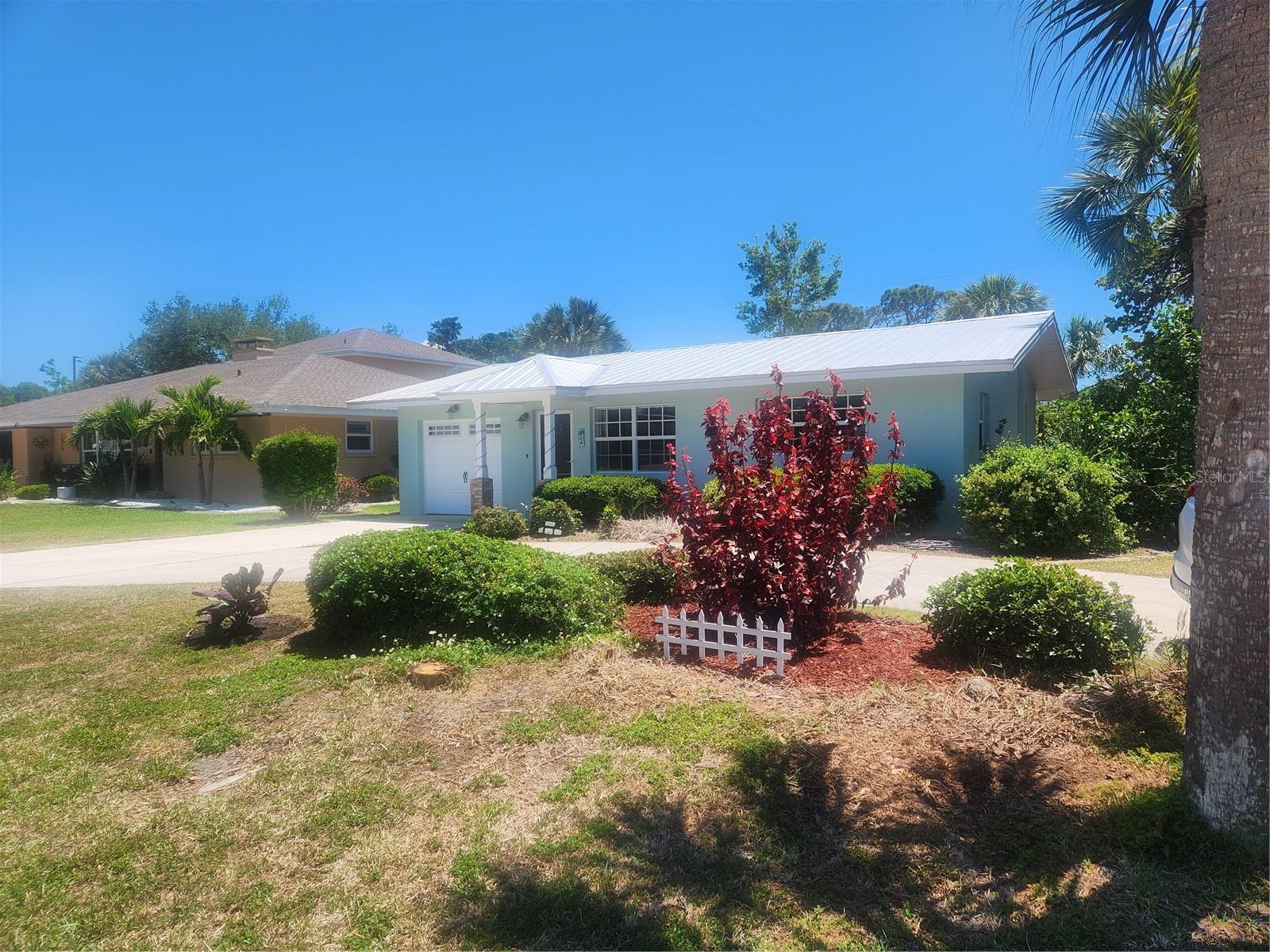 Enjoythe lifestyle, not just buy a home.  Dream of living on an island in Florida!  It is time to turn your dreams into an address. Don’t judge this home by its exterior or square footage.  The outside doesn’t begin to tell the full story of this home.  This home is far more impressive than its exterior suggests including high ceilings, tile throughout, impact windows, and split plan.
Step inside this beach bungalow style home and see it has much more to discover than meets the eye.
The true charm of this home reveals itself once you enter.  Experience island living at its finest with easy access to all the lifestyle amenities you desire. Don’t miss this rare opportunity to own a tranquil tropical retreat in a prime location.  The home features three bedrooms, including a generous primary suite with elegant French doors that open to a relaxing lanai.
Two full bathrooms designed for comfort and style in a popular split plan.  Stunning tile floors throughout, and granite counters offering durability and a sleek, clean look.  The BIG ticket items already done: New Metal roof 2025, New hot water heater 5.2026, New paint interior and exterior, Tree trimming, and newer washer and dryer.
A lush tropical backyard that creates a private paradise with a privacy fence throughout perfect for entertaining or unwinding after a day sharing experiences with family and friends.  Home includes a Paddle board and Kayak racks, loft for extra space in the garage, fishing pole storage, and garage door opener.  The cozy dining room overlooks the backyard and opens to the screen lanai.  
Enjoy golf carting to the historical downtown area for shopping, dining, and entertainment including live Theater.  Like tennis?  There are lighted free tennis courts right in the downtown area.  Have a dog?  How about socializing at the dog park and beach only minutes from your new home?  Enjoy beautiful sunsets?  Only about a 10 minute walk from home to the beach and enjoy a relaxing beautiful view. Legacy trail is practically at your back door to enjoy scenic walks, jogging, or biking on this popular paved trail which also leads to the Gulf and Sharkey's Restaurant or go North to Sarasota if you are an adventurous seeker.
HOME IS NOT IN A FLOOD ZONE, NO HOA RULES OR FEES.  Regular friendly neighborhood where everyone will know your name.

Contact the listing agent today to schedule your private tour! FINAL price reduction