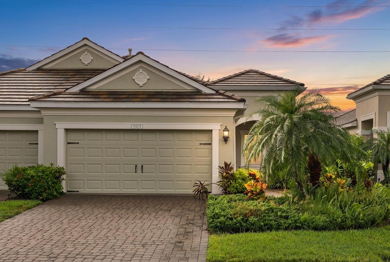 Experience the simplicity and sophistication of Florida’s maintenance-free lifestyle in this beautifully maintained villa in Fairfield. From the moment you step inside, you’re welcomed by a light-filled, open-concept design featuring 16-inch tile flooring and soaring 10-foot ceilings that create an airy, elegant atmosphere.

Designed with seamless indoor-outdoor living in mind, expansive sliding glass doors lead from the main living area to a spacious screened and covered lanai, the perfect setting for morning coffee, evening cocktails, or effortless entertaining.

At the heart of the home, the gourmet kitchen impresses with stainless steel appliances, a stunning oversized waterfall-edge island, gleaming quartz countertops, and rich wood cabinetry. Whether hosting friends or preparing a quiet dinner at home, this space blends beauty and function flawlessly.

The generous owner’s suite offers a private retreat, complete with two walk-in closets and a luxurious en-suite bath featuring dual vanities, a walk-in shower, and a private water closet.

Additional highlights include an attached two-car garage and access to Fairfield’s resort-style amenities, including a heated pool and spa, cabanas, and a state-of-the-art fitness center.

Ideally located just minutes from downtown Bradenton, pristine Gulf Coast beaches, the Manatee Riverwalk, Tampa, St. Pete, and championship golf courses, this home offers the perfect blend of tranquility and convenience. **THIS PROPERTY QUALIFIES FOR A 1% LENDER INCENTIVE IF YOU USE A PREFERRED LENDER. INQUIRE FOR MORE DETAILS!**