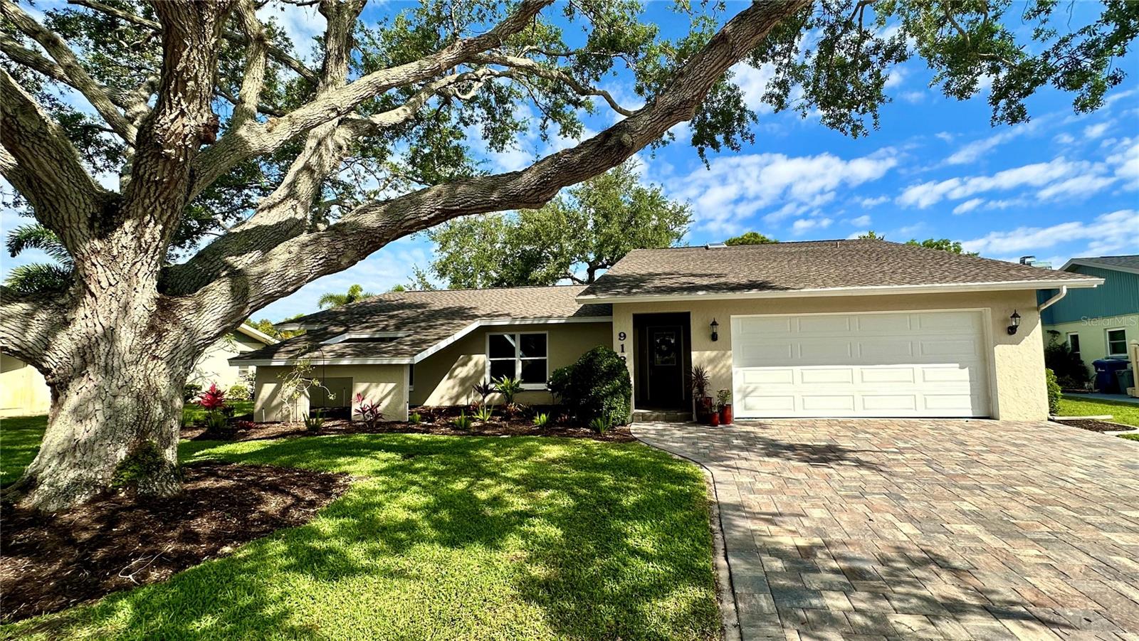 Welcome to your dream home at 913 South Doral Lane, a beautifully renovated residence that combines modern elegance with unparalleled comfort. This exceptional property, nestled on the prestigious Jacaranda West Country Club, offers a serene retreat with breathtaking views of a tranquil pond and the meticulously maintained golf course.

Spanning 2,298 square feet, this home features an open concept layout designed for contemporary living. The family room, with its vaulted ceilings, skylights, and cozy fireplace, creates an inviting atmosphere perfect for relaxation and gatherings. The removal of popcorn ceilings throughout the house adds a sleek, modern touch.

The heart of this home is the remodeled kitchen, equipped with stainless steel appliances, granite-topped cabinets, and a massive center counter space that will inspire your culinary adventures. The split floor plan includes three spacious bedrooms ensuring privacy and comfort. The primary bedroom boasts an ensuite bathroom with dual vanities, a walk-in shower, and two walk-in closets, offering a private oasis after a long day.

Both bathrooms are fully updated with walk-in showers and dual vanities for added convenience. 

Step outside to the enclosed Florida room with fully retractable sliding doors that lead to a screened patio lanai. Here, breathtaking views of the pond and golf course await, offering serene moments of relaxation. The property is framed by mature landscaping and two majestic oak trees, enhancing its curb appeal.

Recent upgrades include a new paver driveway, garage door, windows, electrical updates, A/C unit, and roof—ensuring peace of mind for years to come.

With its over-sized garage and strategic location on a golf course community, this home represents an unparalleled opportunity to live in luxury and comfort. Don't miss out on making 913 South Doral Lane your new address! Bedroom Closet Type: Walk-in Closet (Primary Bedroom).