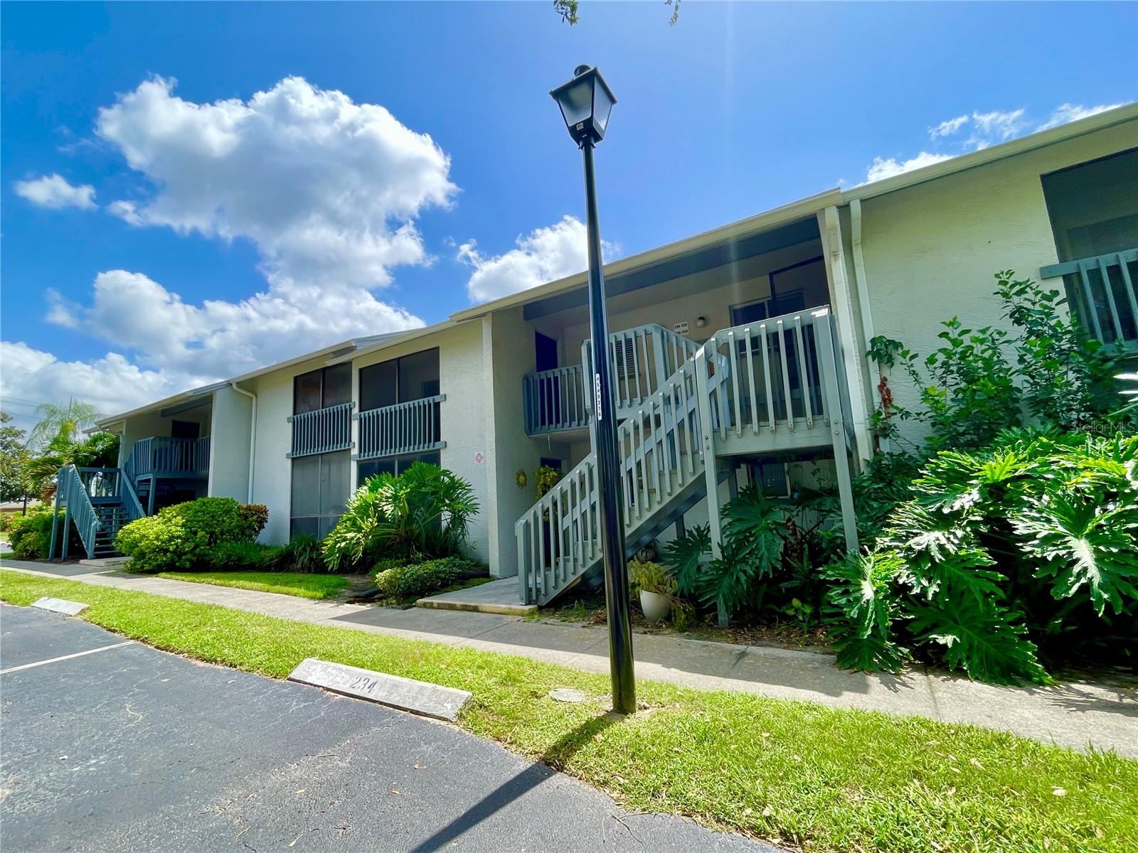 Virtually Staged. Top Floor (second level) updated 2BR/2BA condo in the Shadow Lakes Community of Largo, FL.  
Unit 234 features vaulted/cathedral ceilings which provides an open feel compared to the ground floor models, two private, fully screened-in balconies offering scenic, tranquil views of the community pond/lake.  One of the balconies includes a dedicated outdoor storage closet. Inside utility room with full size washer and dryer.  Luxury vinyl plank flooring throughout the main living areas and bedrooms. Fully equipped kitchen with breakfast bar and dinette area. Tucked away in a quiet well maintained pet friendly community. it sits in a non-flood zone area, meaning required lender flood insurance is typically not required.  Residents have access to two lakeside in-ground swimming pools, a covered pavilion deck with BBQ grill areas, community car wash station and lakeside fishing access. Great primary home or investment property.