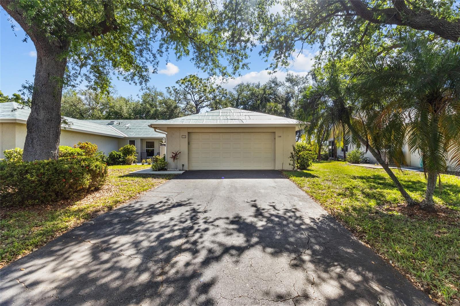 Enjoy effortless Florida living in this turnkey furnished villa in Myrtle Trace at Plantation Golf & Country Club, where exterior maintenance is handled for you, allowing more time to relax and enjoy the lifestyle you came for. This beautifully updated home is in the process of receiving a brand-new durable composite roof designed to offer the classic look of tile with enhanced longevity and performance.

The kitchen has been completely renovated in 2025, featuring white shaker cabinet doors, Corian countertops, a stylish new backsplash, and stainless steel appliances, creating a fresh and modern space at the heart of the home. Just off the kitchen is a versatile flex space, currently used as an office, with sliding doors that lead to a private patio—perfect for convenient outdoor grilling.

Natural light fills the home, highlighting the cathedral ceilings and open floor plan that create an airy and inviting atmosphere. The spacious enclosed lanai serves as a true Florida room, complete with sliding glass doors so it can be enjoyed year-round. From here, you’ll appreciate peaceful views with a glimpse of the 5th hole of the Bobcat Course, offering a relaxing backdrop for entertaining or unwinding.

The thoughtfully designed layout offers excellent storage throughout. The primary suite is generously sized with a large walk-in closet, dual sinks, and a walk-in shower with glass enclosure. The guest suite is equally spacious, featuring its own en-suite bath with a tub/shower combination and a large walk-in closet. A convenient half bath is perfectly situated for guests, making this home ideal for hosting. Both bedrooms comfortably accommodate king-sized furnishings, enhancing the home’s livability.

Additional updates include a 2019 HVAC system, full re-plumbing, and hurricane shutters for all windows, providing peace of mind.

Residents of Myrtle Trace enjoy an active and welcoming community atmosphere with a well-used clubhouse that serves as the hub for social events, including weekly gatherings, coffee meetups, games, and seasonal celebrations. The clubhouse area surrounds a heated pool, where water aerobics and outdoor activities are regularly enjoyed, along with features such as an outdoor shower and gas barbecue.

There is no CDD fee, and optional membership to Plantation Golf & Country Club expands your lifestyle even further with access to two 18-hole championship golf courses, 13 Har-Tru tennis courts, pickleball, bocce ball, a fitness center, Jr. Olympic pool, and exceptional dining and social events.

This turnkey villa offers the perfect opportunity to step right into the Florida lifestyle and start enjoying it immediately.