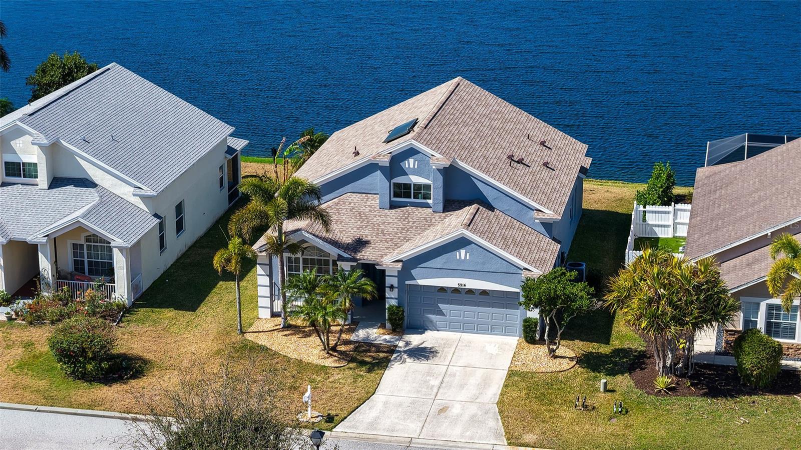 Are You Looking for a Magnificient Waterfront View with Sunsets that will Melt Your Heart?  Look No More...This Beauty Offers a Buyer's Delight...Minimal Utilities and NO CDDs!! No Pets, No Smoking Home is set for Years of No Upcoming Maintenance from the Solar HWH to the Hight Efficiency HVAC, it is Amazing all due to these Additions.  Let the 4/2.5/2 WOW You, not just because it Looks Gorgeous but  Check out what has been done in the Last Two Years...New Roof, New A/C, All New Appliances, New Ceiling Fans, New Paint Inside including Garage Floor, 6 New Outdoor GFCIs and Solar!  It's like a New Home but with the Comfort of a Seasoned Neighborhood with NO CONSTRUCTON to deal with!  As you enter the Spacious Foyer you will be greeted with Gorgeous Bamboo Floors and the the Stacked Formals to the Left and the Laundry Rm (w/a hidden storage area), Powder Bath and Gorgeous Wooden Staircase to the Right.  The Back of the Home opens to an Awesome Eat in Kitchen with Beautiful Granite Countertops, Stunning Custom Cabinets, and a Long Peninsula Breakfast Bar, it's the Heart of the Home where the Magic brings Family and Friends together.  Across from the Kitchen is a Large Family Room which is spacious enough for two Full Size Sofas!!  Lastly, the Primary Suite, tucked away all by itself to maximize Privacy, the Ensuite offers a nice Walk in Closet, Dual Sink Vanity with Make Up area and an Oversized Walk In Shower, Soaking Tub and Private Potty Room!  Upstairs you will find 3 Nicely Appointed Bedrooms, one of which is truly Oversized with a Large Walk in Closet, and a Bonus Area that You Choose it's usage, maybe it's a study area, maybe a TV gathering spot...You decide and lastly a Large Dual Sink Bath with Tub/Shower combo.  There is not a square inch of this Home that is not perfectly designed. Probably the Most Amazing Part of this Home is not in the Home but the View from the Home...It's the Long Lake View of the Pond that stretches over 4 blocks and the Best part, ok, there are Two Best Parts, one, the Sensational Sunsets you will Experience Night After Night but the other is YOU CAN FISH and Catch 5 lb+ Bass in Your Own Backyard!!  Now, if the Home wasn't Fabulous enough, let's talk Convenience...Yep, you have everything at a fingertip's touch...The Pristine West Florida Beaches with that Aquamarine Water, they are just Minutes Away!!  Restaurants, Shopping, literally no matter the direction you go, you have 100s of Restaurants and UTC is 10 minutes, Ellenton Outlet 20!!  I just can't imagine there is a want for anything...Bring your belongings and start enjoying the Florida way of Life!!