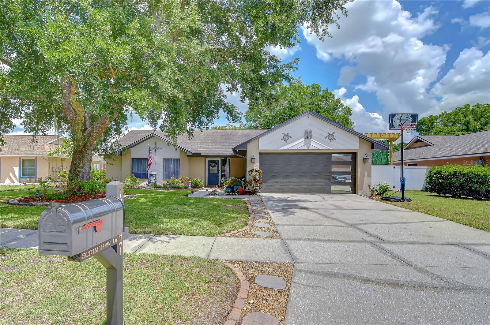 There are no words to describe how incredibly beautiful this home is.!!! This outstanding 3 Bedroom 2 Bathroom is nestled in on a stunning lot with mature landscaping.  From the moment you drive up to the house you will notice how well maintained the house is and how welcoming the entrance feels.  There is also an upgraded new stunning garage door with an accent window. 

Entering the home you will notice how loved this home is and it’s super clean.  From the feature wall in the living room, to the upgraded modern doors inside it will take your breath away. The immaculate kitchen boasts stainless steel appliances, refrigerator, stove, dishwasher, and a new microwave. The upgraded back splash tile adds another style accent to the room.  There is a nice breakfast area to sit by the window and enjoy looking at your backyard. The kitchen has a pass through to a bar area where you can enjoy entertaining while cooking.

The primary bedroom is gorgeous featuring a nice layout, a walk-in closet, upgraded lighting, with beautiful laminate flooring and an upgraded en-suite bathroom. This is the perfect retreat.  The split floor plan offers lots of privacy for the primary bedroom.
 
Bedroom 2 is large has a lovely view of the backyard, the room also features tile flooring that looks like wood, an updated closet door, and a pretty fan.

Bathroom 2 is located between Bedroom 2 and Bedroom 3.  This bathroom has a stunning granite counter top, white cabinets, and a tub/shower combination.

Bedroom 3 is large and has tile flooring that looks like wood, and an updated closet door. Bedroom three also has a ceiling fan.

A Huge screened in lanai adds to the entertaining space, bring your friends or gather with lots of family, or just relax after a long day.  Now lets talk about this Backyard, definitely a crowd favorite, your guest will be in awe of this one. It is a Wow - with it’s 3 gazebos, new grass, 2 storage sheds, and a generator hook up, (Bring your own generator)

The garage is all that too it boast a new upgraded garage door with a window.  You can see out but if outside you can’t see in.  There is magnificent upgraded lighting. It truly is an extension of the house because it is perfect as a workspace.  It even has an EV hookup and it’s got ac so you can enjoy this space year round.  
 
This home is zoned for Steinbrenner High School.  Close to shopping, and hospitals.  The Veterans Expressway is close and you can easily access downtown in minutes. The home plumbing has also been completely upgraded.  There is also a new water softener system. 

This home is your new address make an appointment today! I know you will fall in love.