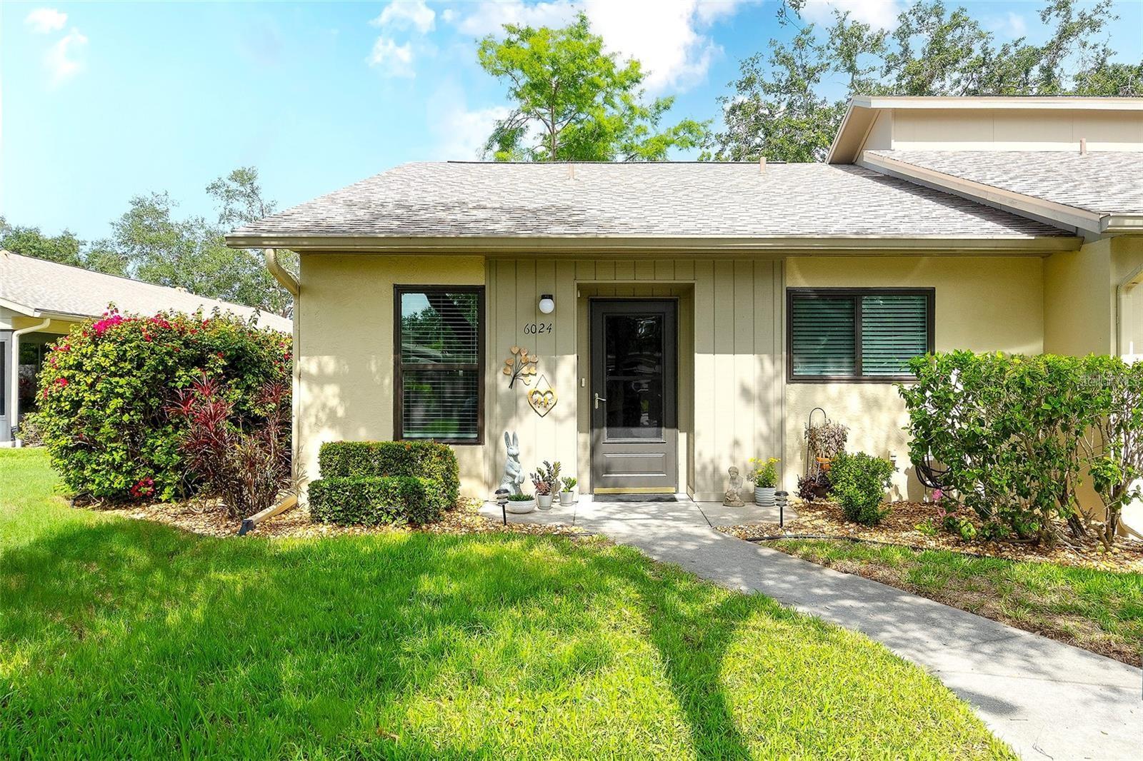 PRICE REDUCTION!  This beautifully updated, 2 bedroom/2 bath, garden style condominium home in the highly desirable, ALL SINGLE-STORY Huntington Woods community. The updates include HIGH IMPACT RESISTANT HURRICANE WINDOWS, remodeled kitchen with stainless steel appliances, convection oven, built-in microwave with drop-down air filtration, Cambria quartz countertops and room for an eat-in table. The kitchen looks out into the dining/great room area with luxury vinyl plank flooring, vaulted ceiling and bright dimmable LED light fixtures throughout. The fully updated and brightly lit bathrooms include Italian porcelain tile surrounds, Cambria quartz counters, built-in marble niches and marble trim, and Kohler sinks. The A/C system was replaced in 2021 and has a smart Wi-Fi thermostat (adjust it from anywhere). The laundry room has a new full-size washer and new dryer. The master bedroom has room for a King bed and features an ensuite bathroom and a new custom walk-in closet, with many more closets throughout the home. The forward-looking condo association has relatively low monthly condo fees thanks to fully funded reserves, and all updates have been completed: new roofs, repainting, and updates throughout the community. All buildings are SINGLE STORY (none of the issues with high-rise condos) with only four condos in each building, making for a quiet, relaxing community. This condo includes its own assigned covered parking space and ample open parking nearby. The monthly condo fee includes property management, grounds, pool, and building maintenance and insurance, Spectrum high-speed Wi-Fi and cable. Huntington Woods is ideally located between downtown Sarasota and downtown Bradenton. It is close to beaches, preserves and parks, world class restaurants, shopping, IMG Academy, golf, tennis, gyms, and healthcare.