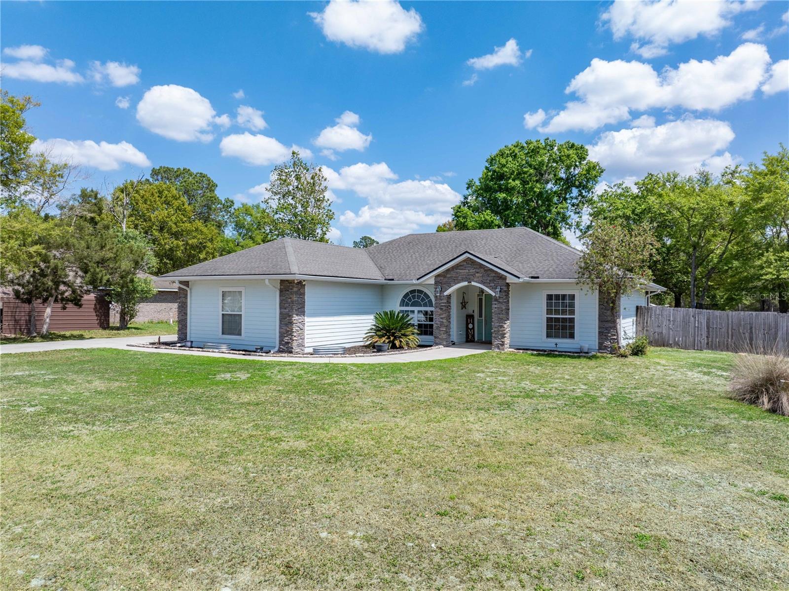 Welcome to this beautifully maintained 3-bedroom, 2-bath home situated on a spacious ½-acre corner lot just outside the city limits of Lake Butler—perfect for those looking for room to grow and play. Featuring durable Hardiboard siding with stone accents, this home has both curb appeal and long-lasting quality. Inside, you’ll find a bright and inviting open floor plan with a large great room, breakfast nook, and a separate dining area currently used as a home office—ideal for today’s flexible lifestyles. The primary suite features an elegant trey ceiling, walk-in closet, and private bath, creating a relaxing retreat at the end of the day. Step outside and enjoy everything Florida living is known for with a screened back porch, a fully fenced backyard perfect for pets, and a well-maintained above-ground pool with a surrounding deck ready for summer fun and weekend gatherings. With an indoor laundry room, an attached garage and plenty of outdoor space, this property offers both comfort and functionality. Conveniently located in Southwest Union County, you’ll enjoy a peaceful setting with easy access—approximately 30 minutes to Gainesville or Lake City and just 25 minutes to Alachua—making this home the perfect blend of quiet country living and everyday convenience.