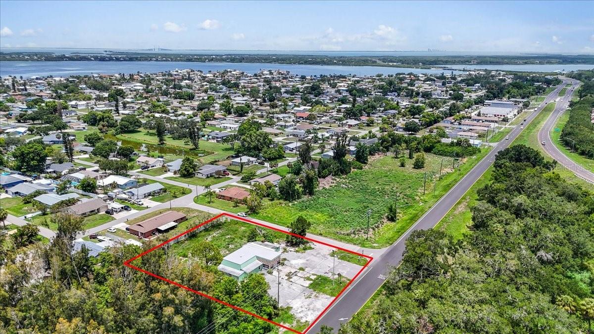 Rarely available commercial parcel on the US 19 corridor in fast-growing North Manatee County. 11,000+/- traffic county. At 0.69± acres with NC-M zoning already in place, this site is entitlement-ready for a neighborhood commercial user or investor; no rezone required for a broad menu of retail, service, and office uses.

Zoning & Permitted Uses (Manatee County LDC — NC-M District)

The NC-M (Neighborhood Commercial – Medium) district is designed to provide retail uses, personal services, and offices in free-standing parcels or medium shopping centers serving surrounding residential neighborhoods. Use categories accommodated under NC-M include:

Retail sales: neighborhood-serving retail and convenience uses
Personal services: salon/spa, dry cleaning drop-off, fitness/wellness studio, and similar service businesses
Professional & business offices: insurance, legal, accounting, real estate, financial services
Medical & dental office: outpatient clinic, therapy, and healthcare service uses
Food service: café/restaurant uses serving the surrounding trade area
Mixed-use potential:the current LDC contemplates mixed-use, including attached dwellings and multi-family residential, in NC-M within designated Urban Corridors and activity nodes

NC-M permits up to 50,000 SF of gross building square footage per project; meaning the buildable envelope here is governed by site design (parking, setbacks, stormwater), not by a restrictive commercial cap.