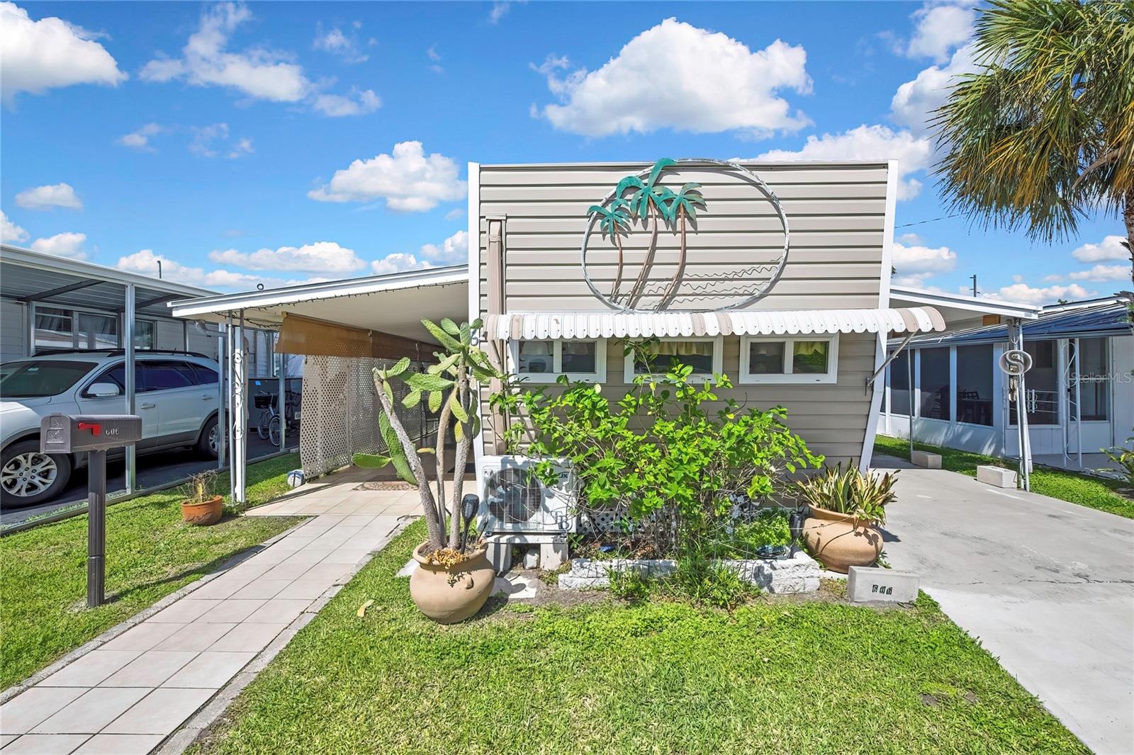 800 32nd Ave S #606 – Move-in ready 2BR/1BA in desirable 55+ Lakeshore Mobile Home Park! This 440 sq ft home features an open living/dining layout, bright interior, and efficient use of space. Built in 1960 and updated, the property offers central A/C, updated finishes, ceiling fans, and a flexible guest room/office. Public records state the home includes approximately 1,100 total sq ft, a covered carport, and sits within a 13-acre co-op community.

Enjoy outdoor living with a patio and outdoor kitchen area—perfect for entertaining. Low-maintenance co-op ownership with no lot rent and affordable taxes. Furnishings negotiable. Community amenities include a pool and clubhouse, making this an ideal seasonal or full-time Florida retreat.