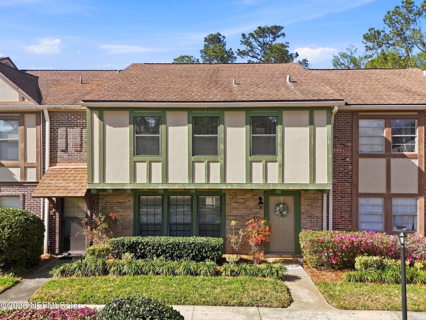 One or more photo(s) has been virtually staged. Welcome to Sutton Place! This charming townhome offers comfortable living in a convenient Jacksonville location just minutes from San Marco, Downtown Jacksonville, and the Riverside entertainment district. The home features a spacious living area, a dining space with a breakfast bar, and tile flooring throughout the main level. The updated kitchen provides an open layout and functional space for everyday living. Upstairs, the primary suite includes a spacious bathroom and a large walk-in closet, while additional bedrooms and a second bathroom provide flexible use options such as guest rooms, workspace, or hobby space. Enjoy relaxing outdoors in the private fenced backyard patio. The HOA covers exterior maintenance, grounds upkeep, and access to a newly updated pool and clubhouse area. Conveniently located near shopping, dining, and major roadways for easy access throughout Jacksonville.