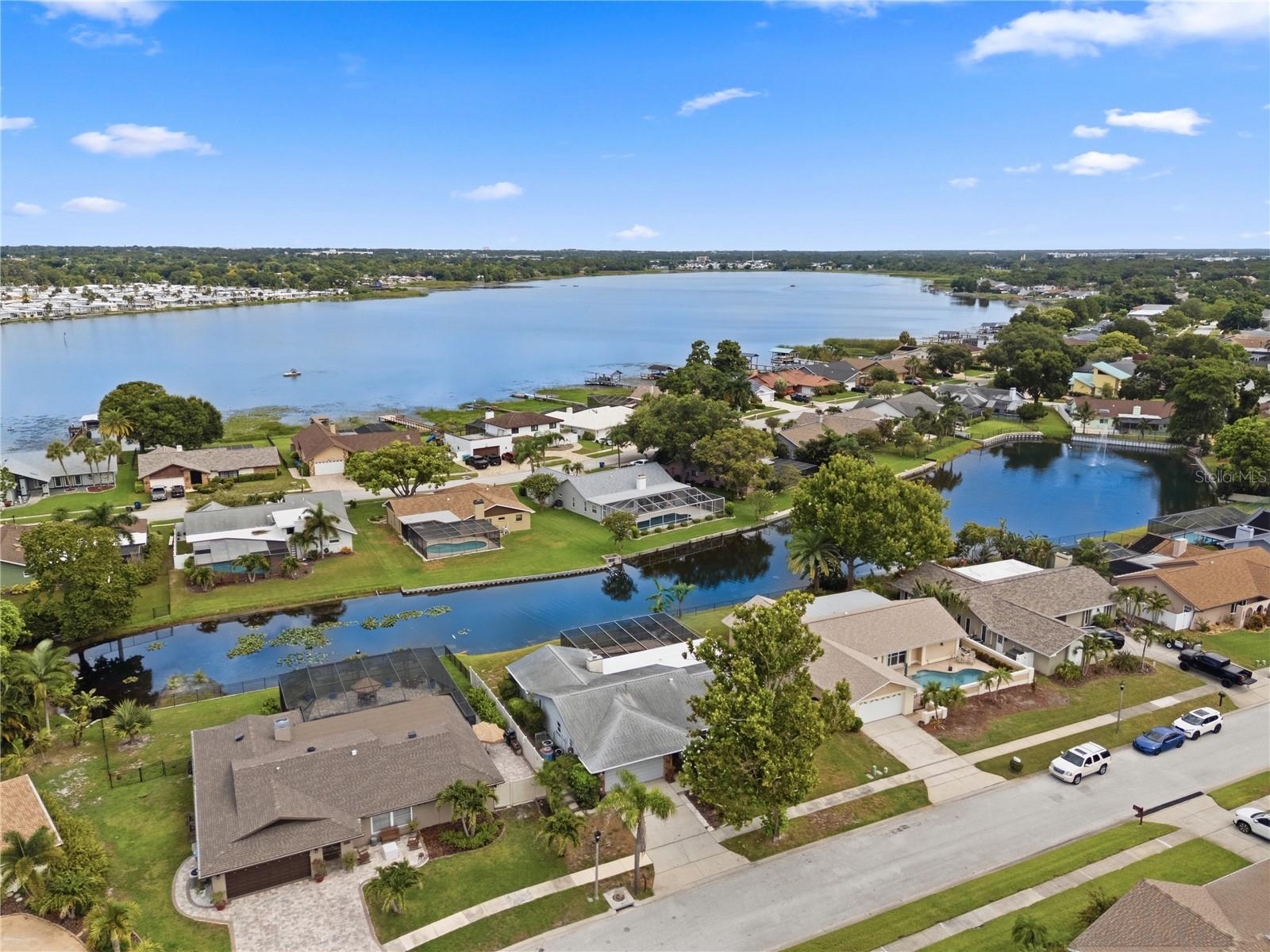 ____________________________________________________________________________________________________________________
Welcome to your peaceful private pool home positioned on tranquil waters in the desirable deed-restricted neighborhood of Lake Park Estates. ____________________________________________________________________________________________________________________
This home gives more than just a place to live - it offers a lifestyle of comfort, convenience, and peaceful waterfront beauty in one of Pinellas County's most sought after locations. Here is a charming three bedroom, two bathroom is: spacious all ground floor - open split plan - large living, dining and family rooms - cozy gas log fireplace - vaulted ceilings - big covered back patio - impressive covered pool deck - refreshing screened pool. All overlook tranquil waters yet elevated, high and dry with NO evacuation necessary. _______________________________________________________________________________________________________________________ $200,000 plus was invested in recent years by the proud homeowner to update and upgrade this fine home. You will have peace of mind knowing that major components and elements have not reached the end of their useful lifel New Flooring in 2 Bedrooms in 2026, New A/C, Master Bath Remodeled, House Painted Outside and Landscaping in 2025, Gas Water Heater in 2024, Yard Sprinkler System updated in 2023, Re-screened Pool Cage in 2022, Guest Bathroom Remodeled in 2021, Kitchen Remodeled w/New Appliances in 2018, Impact Resistant Windows Installed in 2017. A full list is in MLS attached documents. ____________________________________________________________________________________________________________________
The completely updated kitchen is perfect for the chef in the family, equipped with ample wood cabinetry and exceptional storage, elegant granite countertops and stainless appliances. The kitchen opens into the dining room for guests to be together while meals are being prepared.  Open the two sets of the expansive screened porch, seamlessly giving additional space for family gatherings at any time through the year. The thoughtful split floor plan features primary suite with ensuite bath, while the two additional spacious bedrooms are on the opposite side of the home. Bathrooms have been tastefully updated to provide modern, fresh feelings. The 2-car oversized garage has a versatile air-conditioned room space off the garage - a great option for those who have work from home needs or could be used for a game room, playroom or anything else you need. The mix of electric A/C with gas stove, fireplace, water heater and heat makes the living space comfortable, relaxing and less vulnerable. ____________________________________________________________________________________________________________________ This location gives a rare feeling of being tucked away in a quiet neighborhood yet just minutes from shopping, dining, entertainment, and everyday conveniences. 25 minutes from Tampa International Airport. 20 minutes from downtown St. Petersburg or Clearwater and 15 minutes from the soft white sand and skies ablaze multi color skies as the sun slowly sets into the Gulf.
____________________________________________________________________________________________________________________