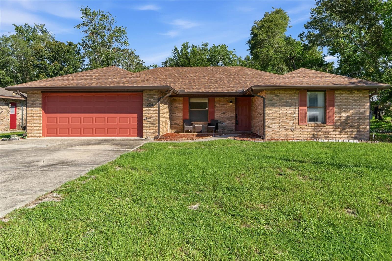 Looking for an oversized lot with all of the big-ticket expenses taken care of? This home offers a great sense of privacy, highlighted by the open green space directly across the street—meaning no front-facing neighbors will be building there. Inside, the layout is incredibly practical and flexible with the newly remodeled kitchen being in the middle of it all. A standout feature of this property is the second suite. This dedicated space is the perfect setup for multi-generational living, a private guest retreat, or a home office. Not to mention the formal dining room can be used as a flex space or a bedroom!

Enjoy the Florida weather year-round from your spacious porch, which features brand-new screens. Out back, the massive yard provides plenty of room for outdoor entertaining, gardening, or just having space to breathe. Best of all, the major mechanicals are already handled. The roof was just replaced in 2025, and a brand-new electrical panel was installed in March of this year. The HVAC system was upgraded in 2021, the water heater in 2017, and the drainfield was replaced in 2019, with the septic tank recently emptied. With a highly flexible, multi-generational layout and the heavy lifting already done, this home is an absolute must-see.